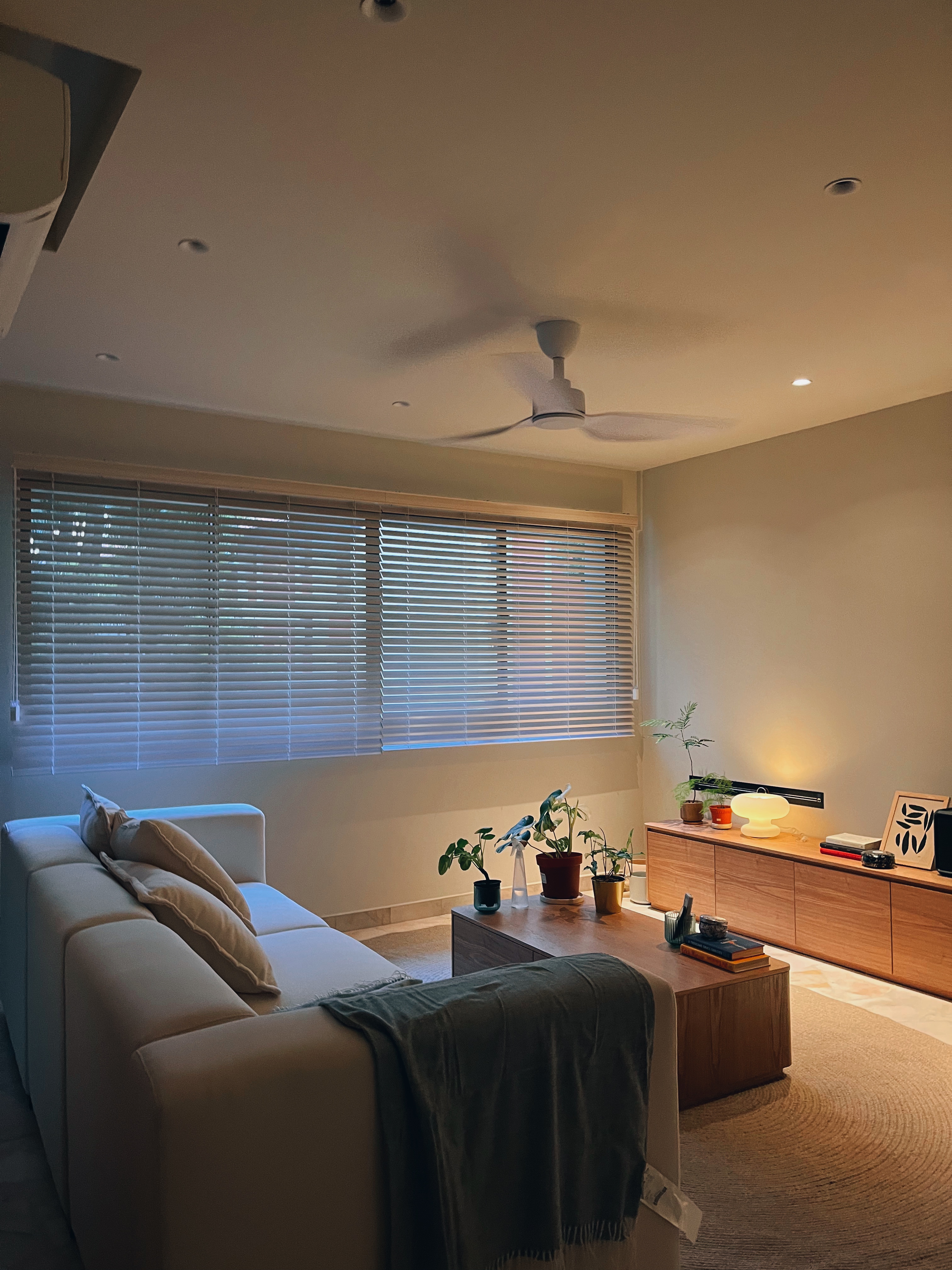 From dawn to dusk: same space, absolutely different vibes! - Modern living room, cozy seating, beige sofa, soft lighting