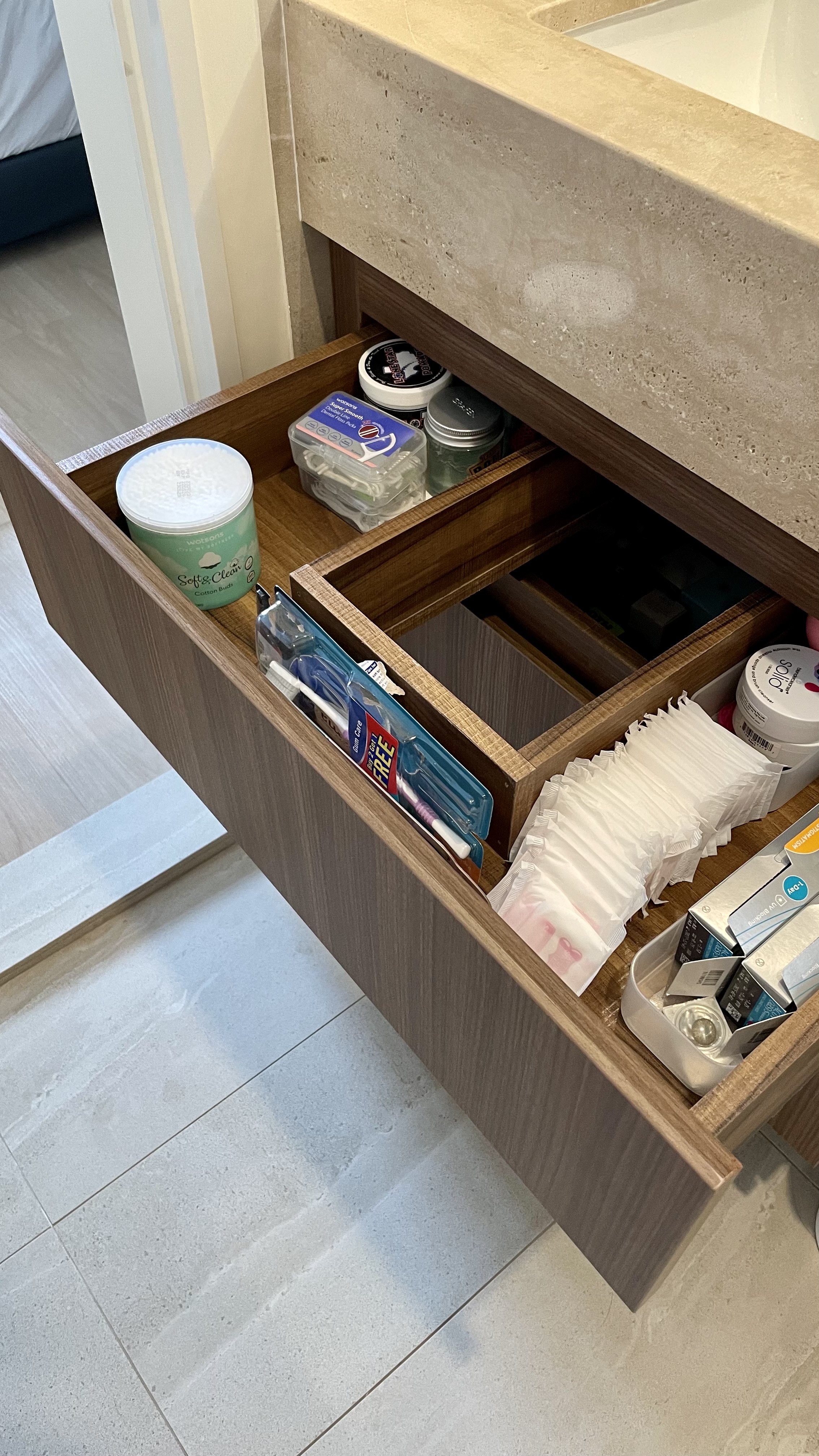 Travertine Hotel Bathroom in BTO - Bathroom drawer, neatly organized, wooden interior, storage solutions, toiletries, cotton
