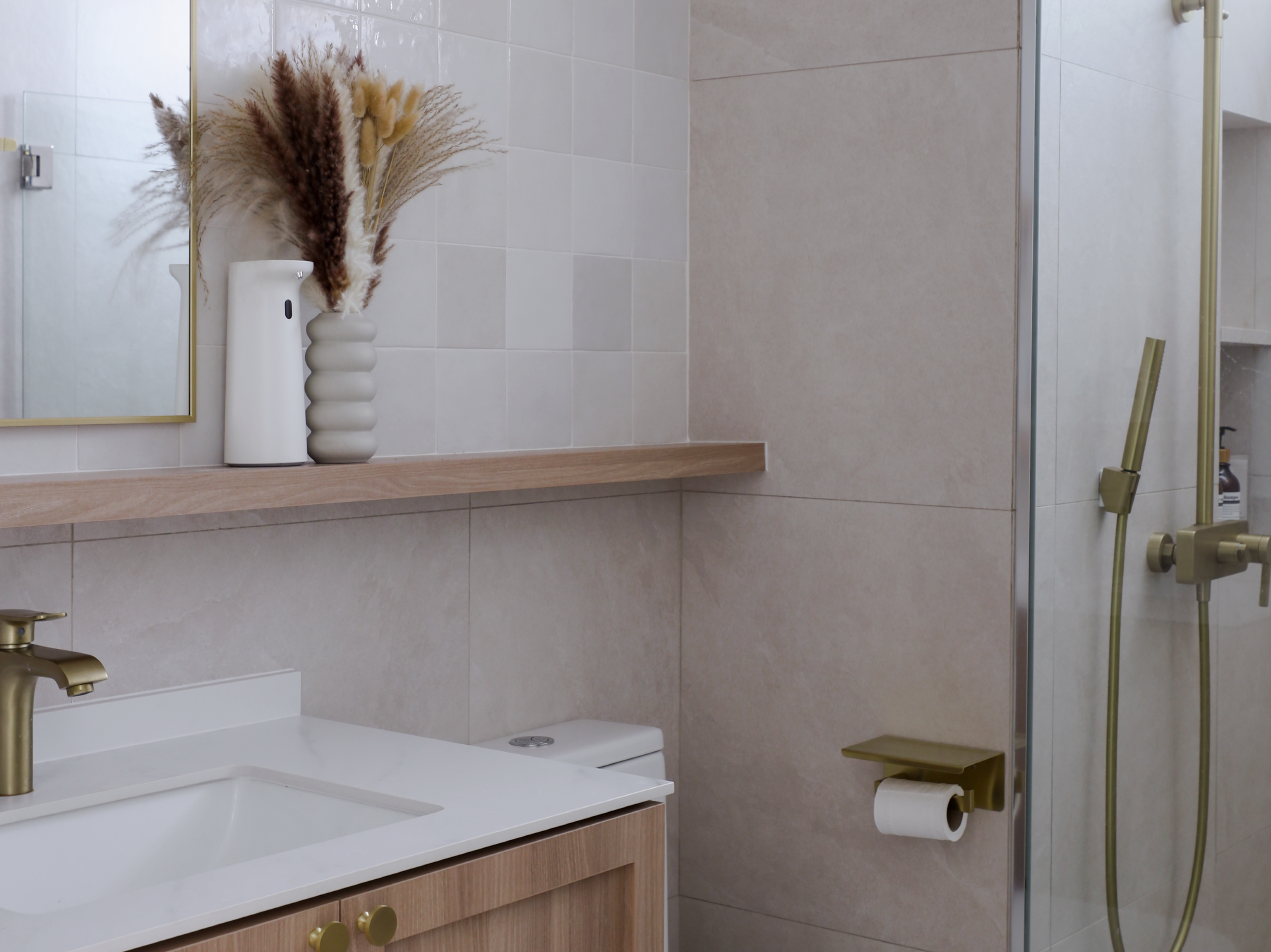 Bright and airy kids friendly home with lots of curves - White bathroom vanity, gold faucet, wooden shelf, modern design