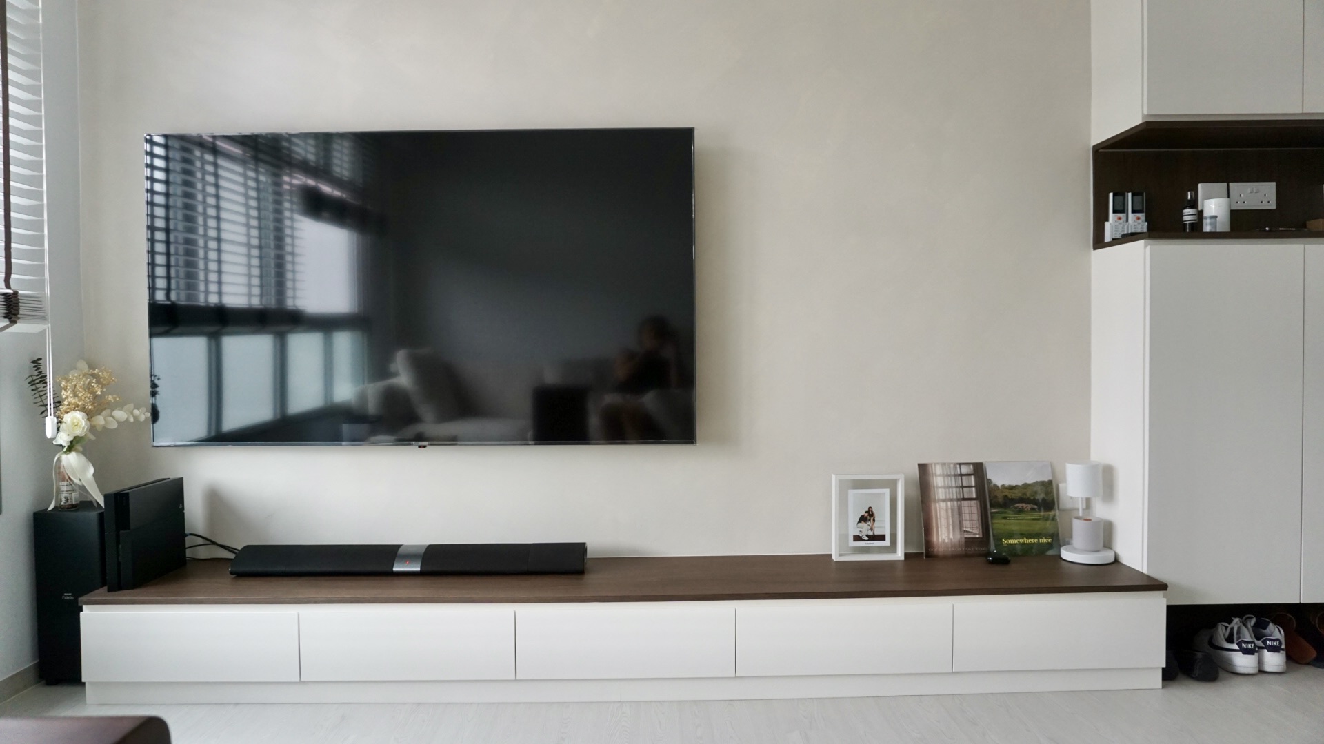 Creating our abode on cloud9, without an ID.  - Modern living room, minimalist decor, sleek TV stand, white cabinets, black