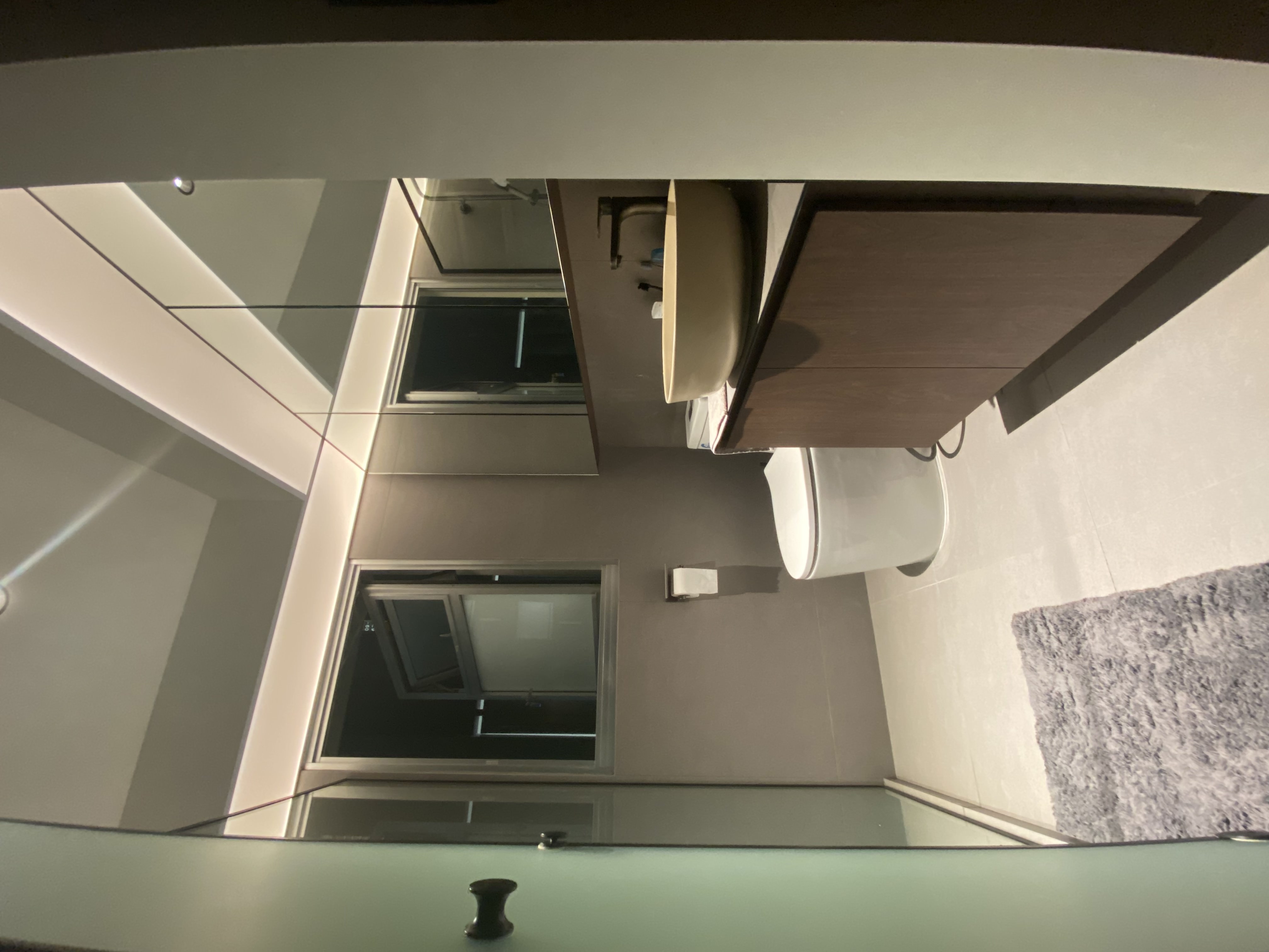 This is where the fun choice starts - Modern minimalist bathroom, sleek design, large mirror, built-in sink, floating vanity