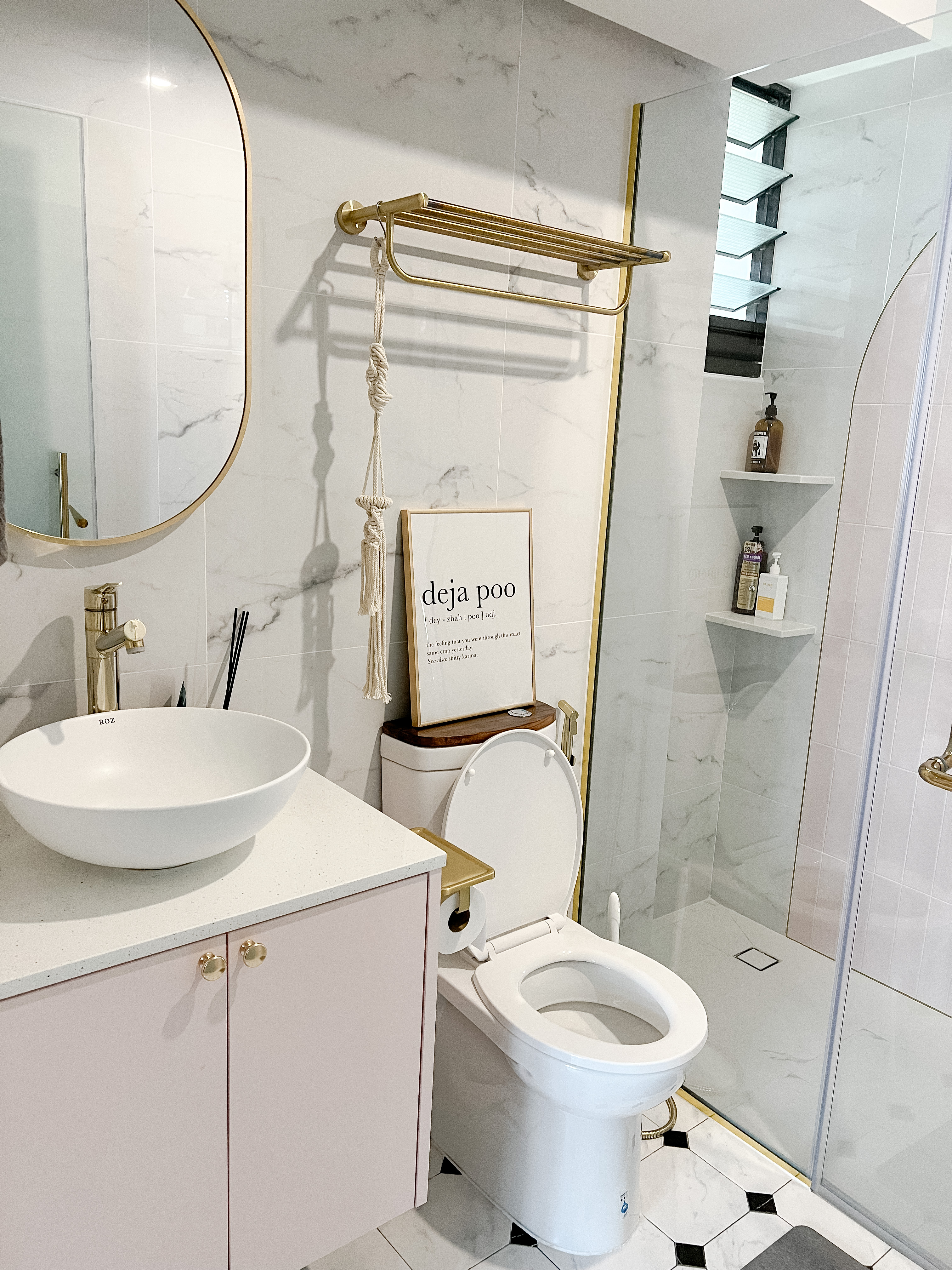 A peek into a 4 Room BTO at Northeast - White marble tiles, gold fixtures, modern sink, gold faucet, minimalist design