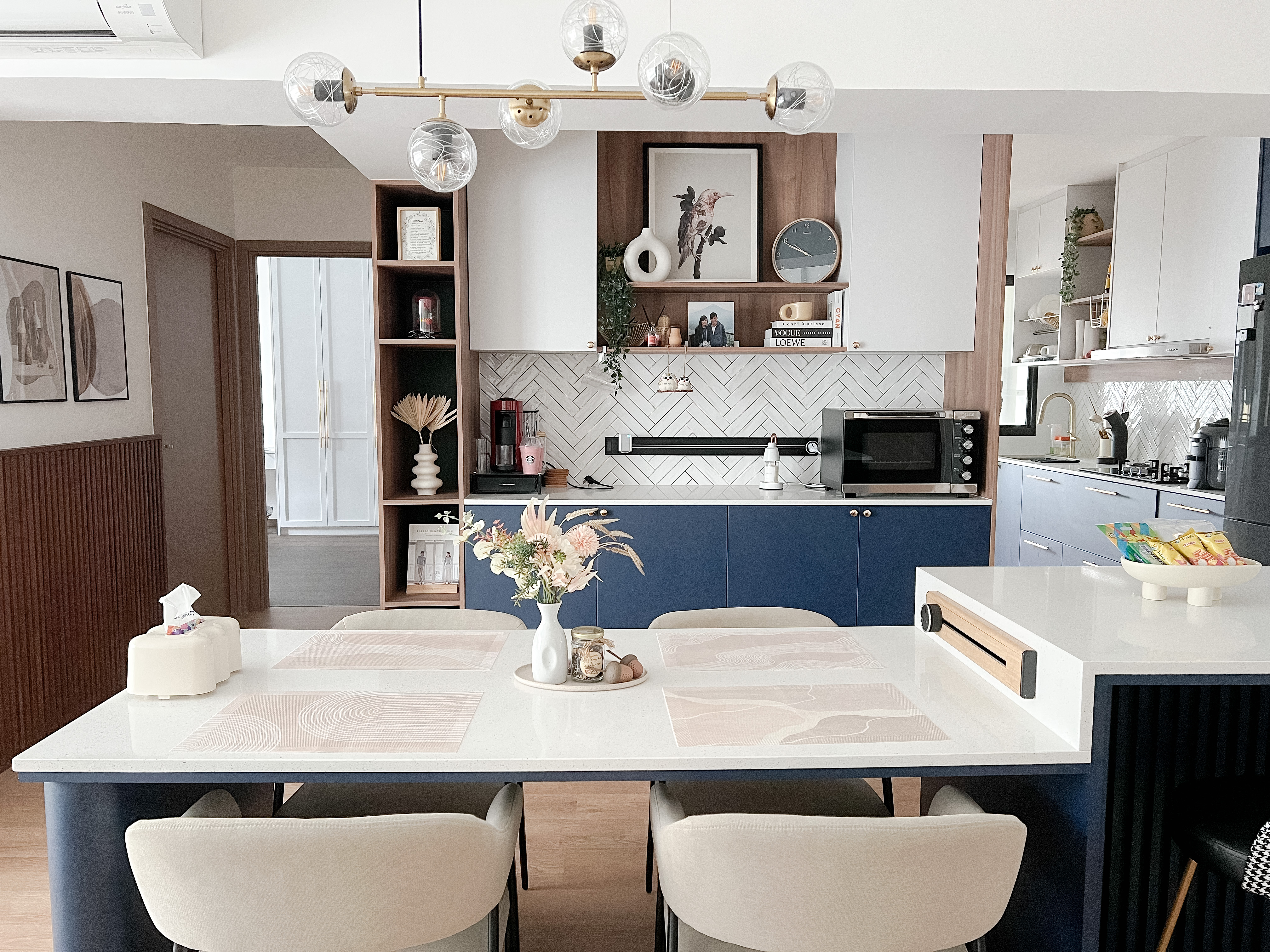 A peek into a 4 Room BTO at Northeast - Modern kitchen with white and blue color scheme, sleek design, open shelving