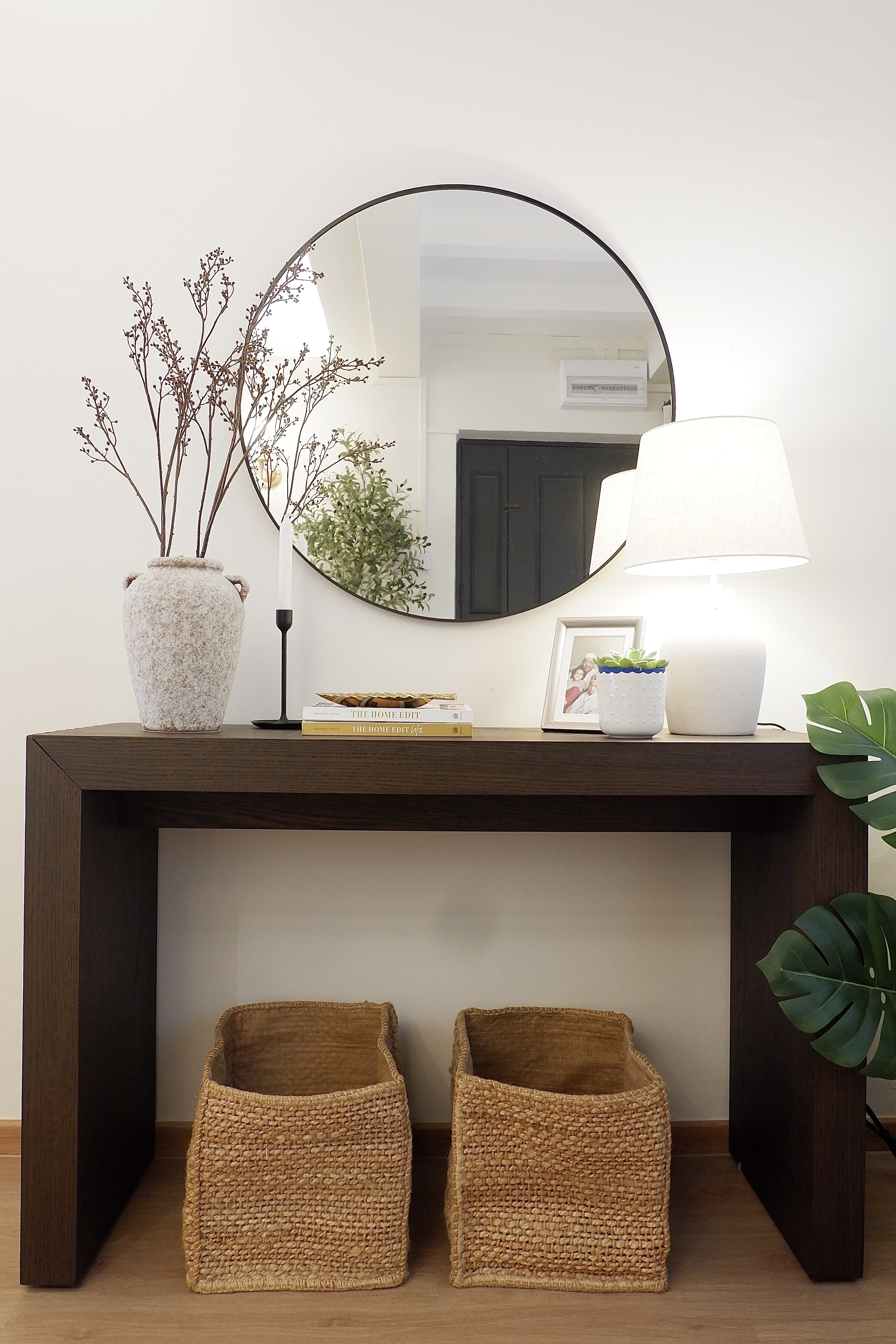 Designing our own modern farmhouse. - vase with dried branches, black candle holder, white lamp, framed photo, indoor plant