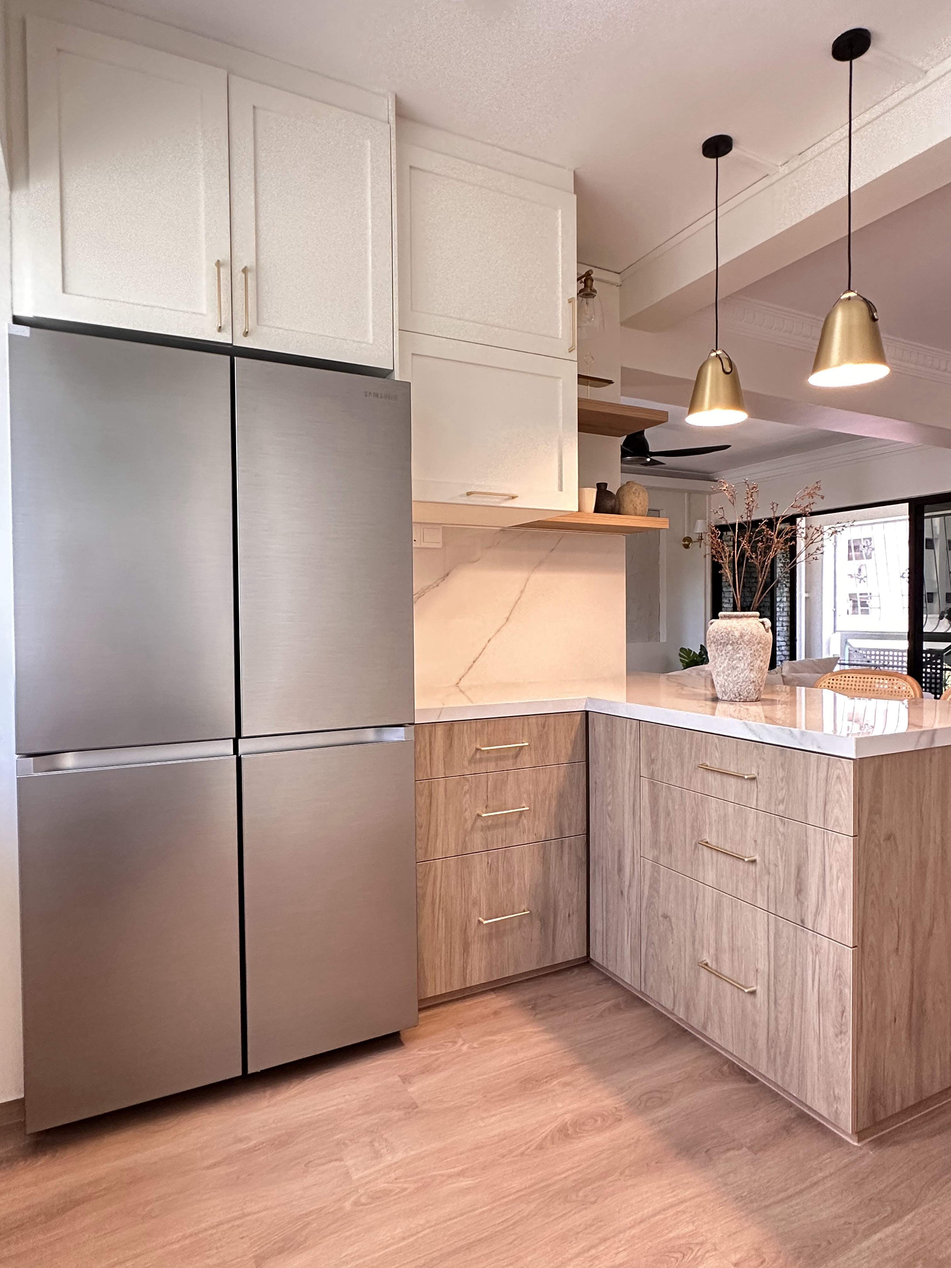 Designing our own modern farmhouse. - Modern kitchen with stainless steel refrigerator, white cabinets with gold handles