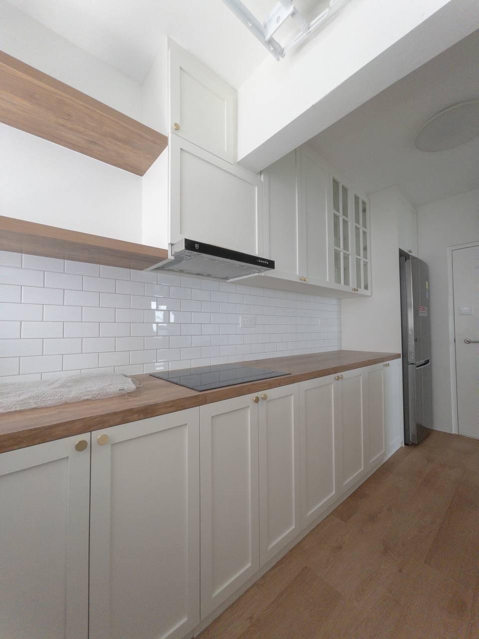 Step into our smol house with a farmhouse kitchen theme - White kitchen with wooden accents, stainless steel range hood