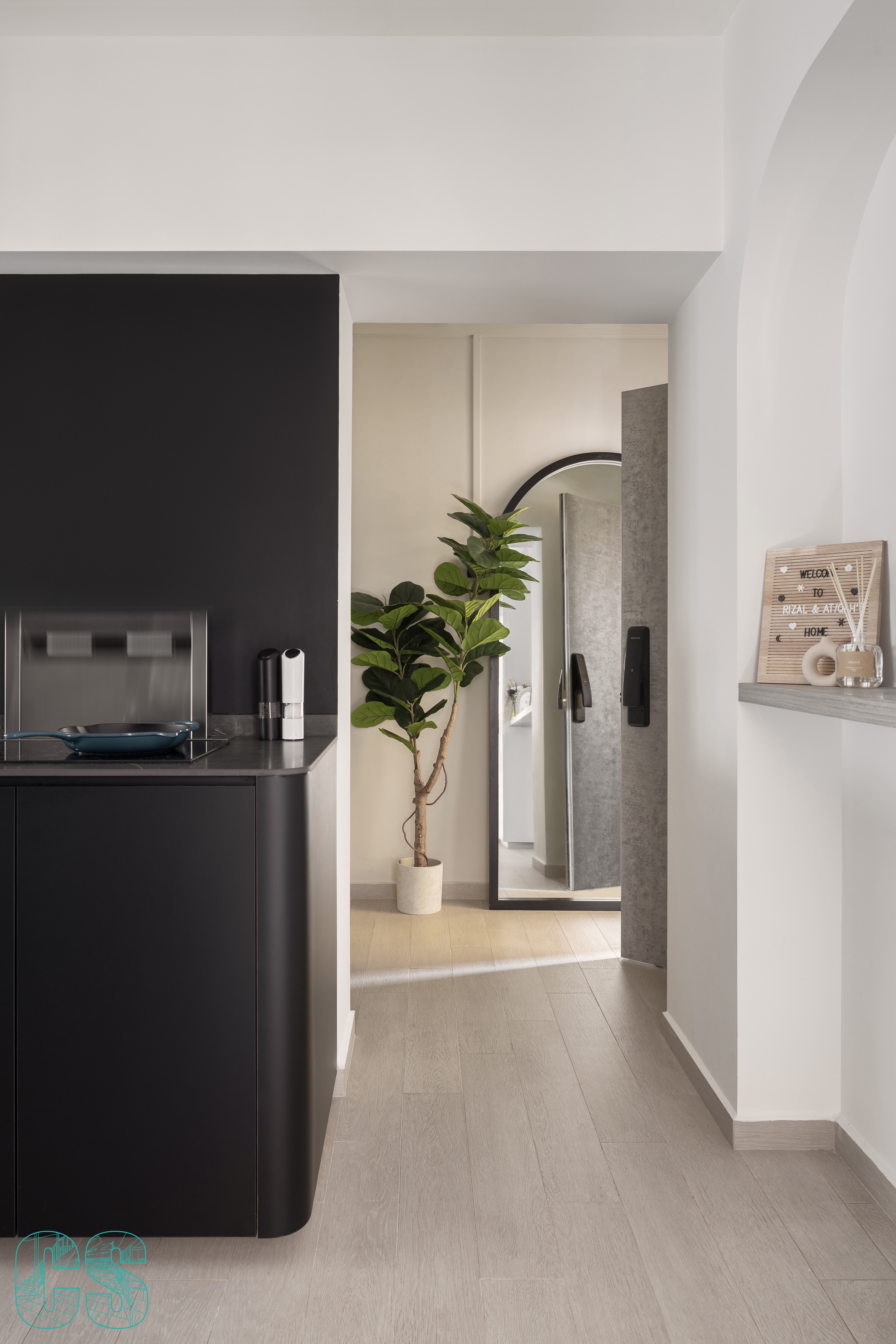 Living in Curves - modern kitchen, minimalist design, sleek appliances, black cabinets, stainless steel backsplash, open