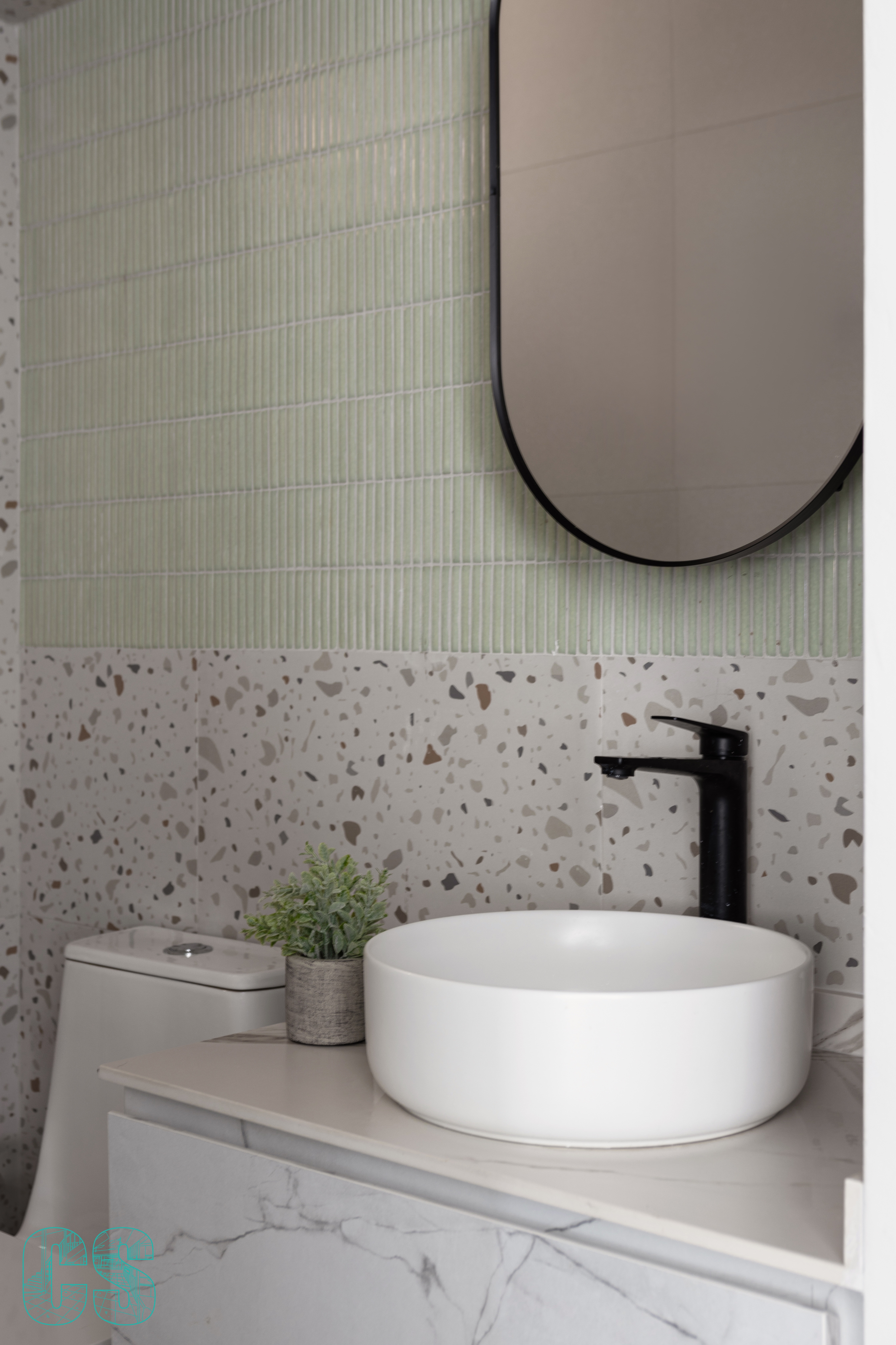Living in Curves - Modern bathroom, minimalist design, white porcelain sink, speckled tile backsplash, oval mirror, sleek
