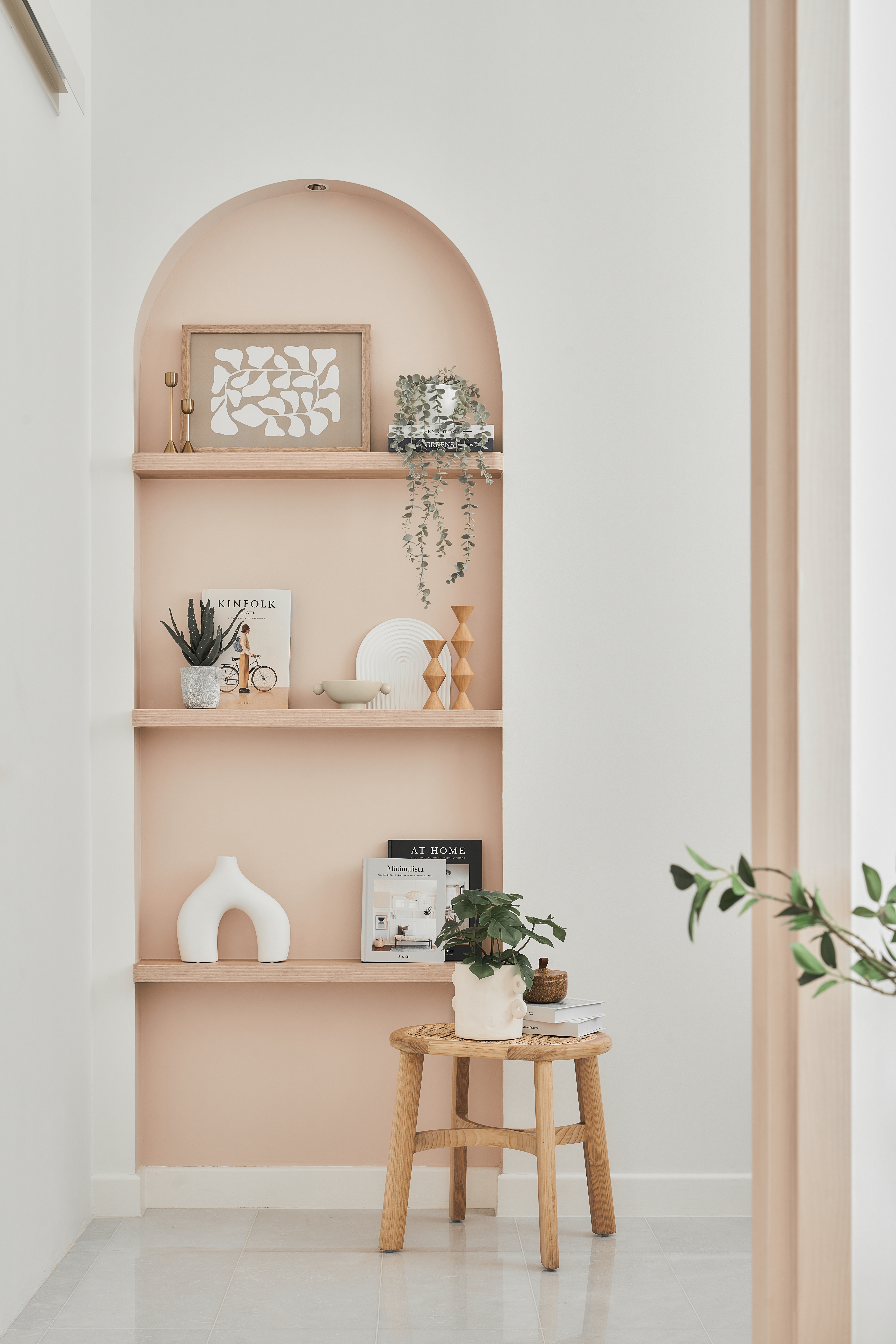 Urban Farmhouse Living - Bright & Airy Condo in the East - Arched alcove, minimalist decor, pastel pink wall, wooden shelves