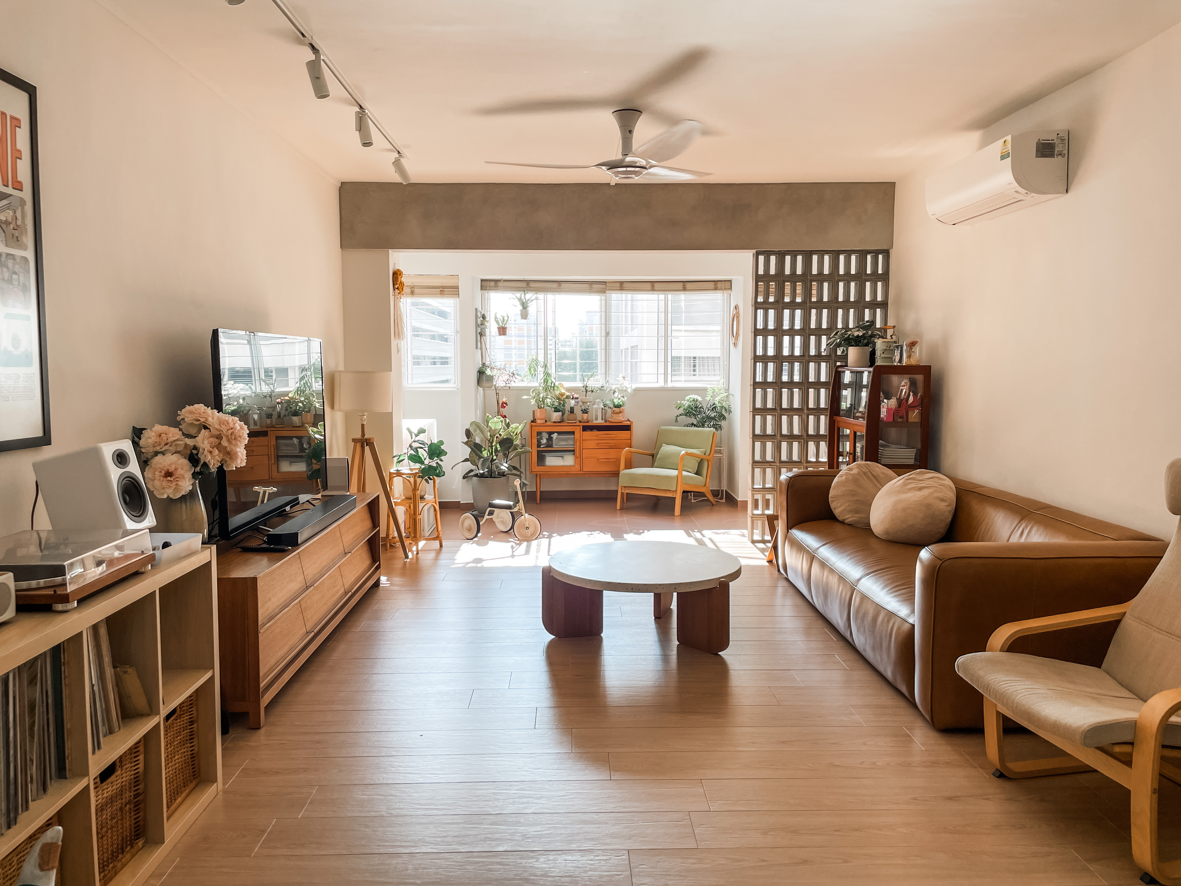 Light-filled, Open-plan Scandi Executive Apartment - Modern living room with large windows, wooden furniture, comfortable