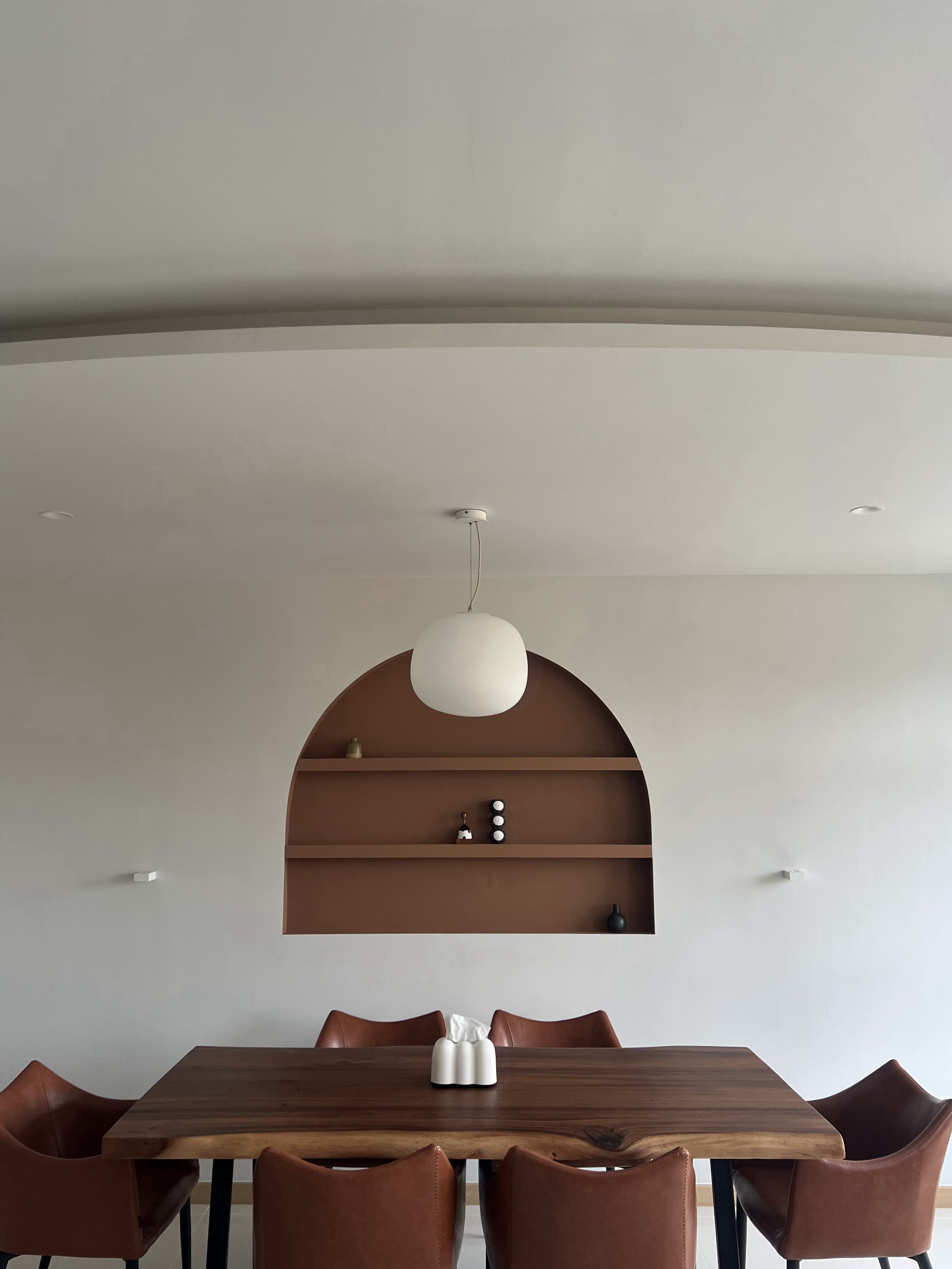 From Blank Canvas to Cosy Haven - Modern dining room with minimalist design, wooden dining table and chairs, brown leather