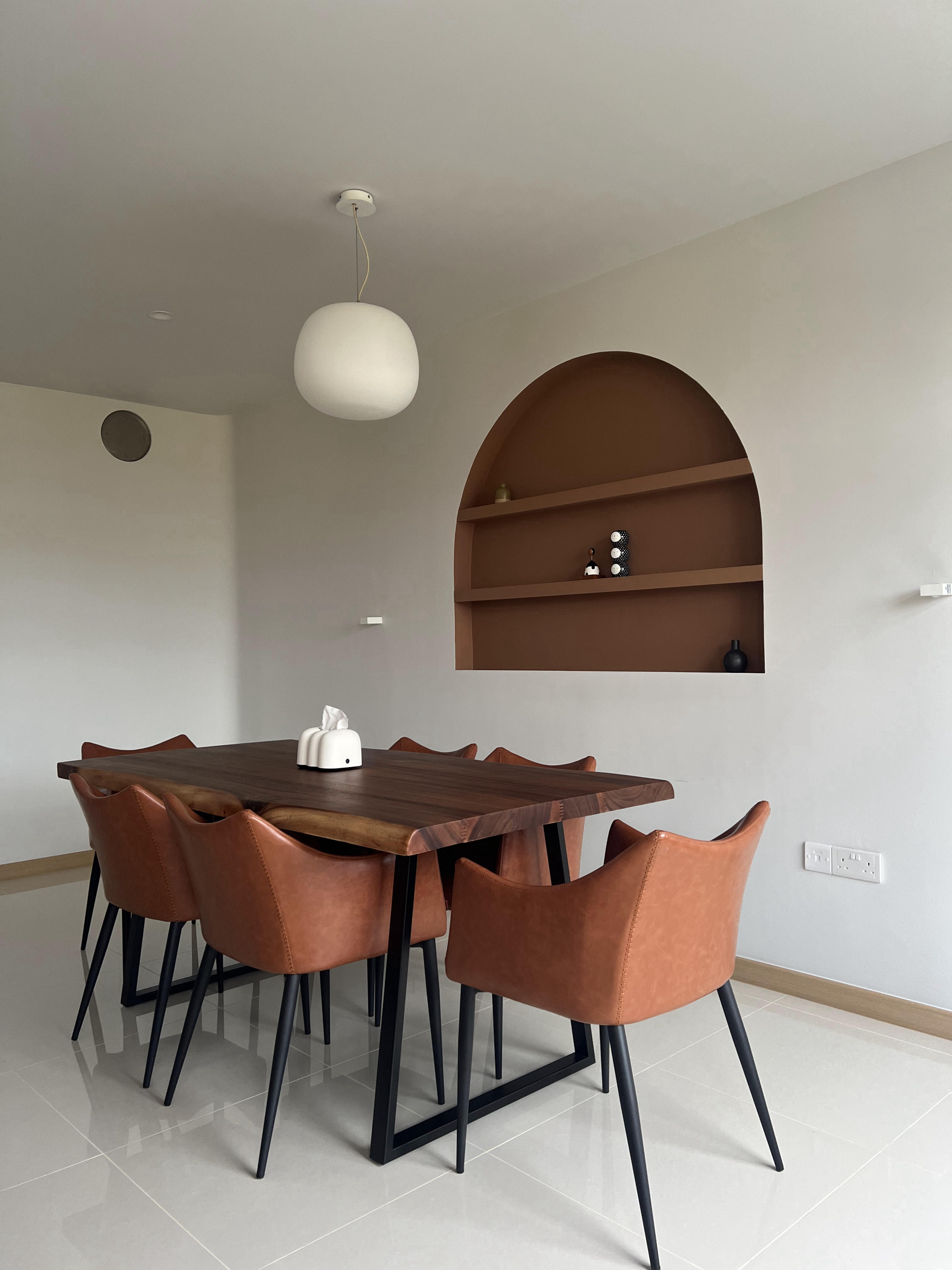 From Blank Canvas to Cosy Haven - Modern dining room with sleek brown wooden table and four brown leather chairs, minimalist
