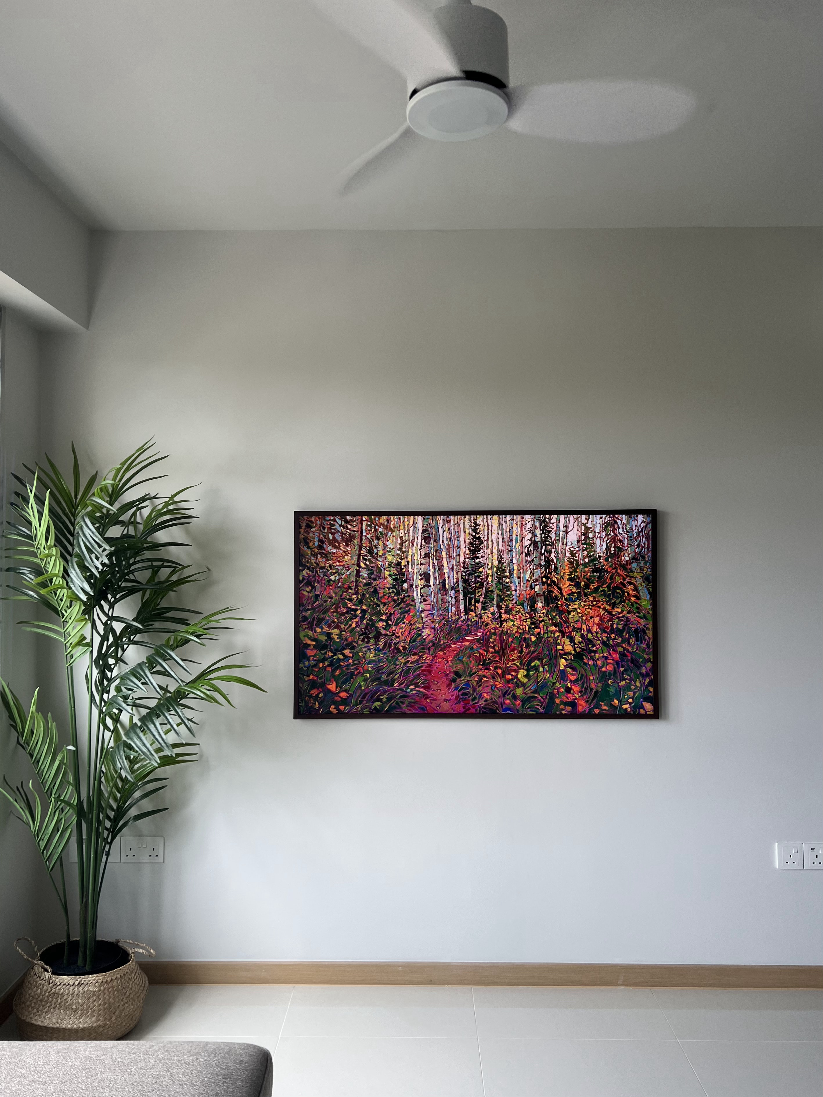 From Blank Canvas to Cosy Haven - Framed vibrant forest painting, modern minimalist interior, natural elements, lush green