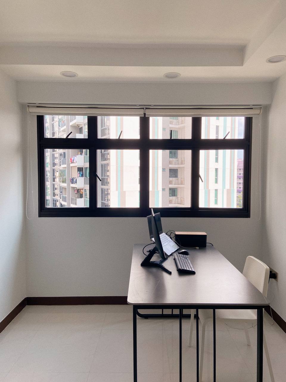 Mid-modern century with hand-me-down built-ins - Modern minimalist home office, spacious room with large window, black desk