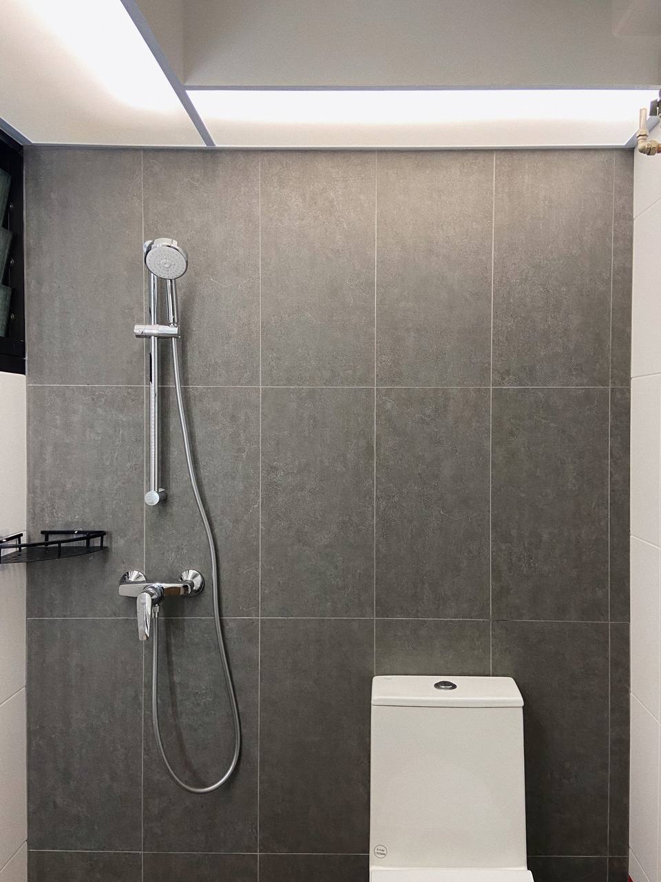 Mid-modern century with hand-me-down built-ins - Grey tiled bathroom, modern shower, sleek fixtures, minimalist design, tiled