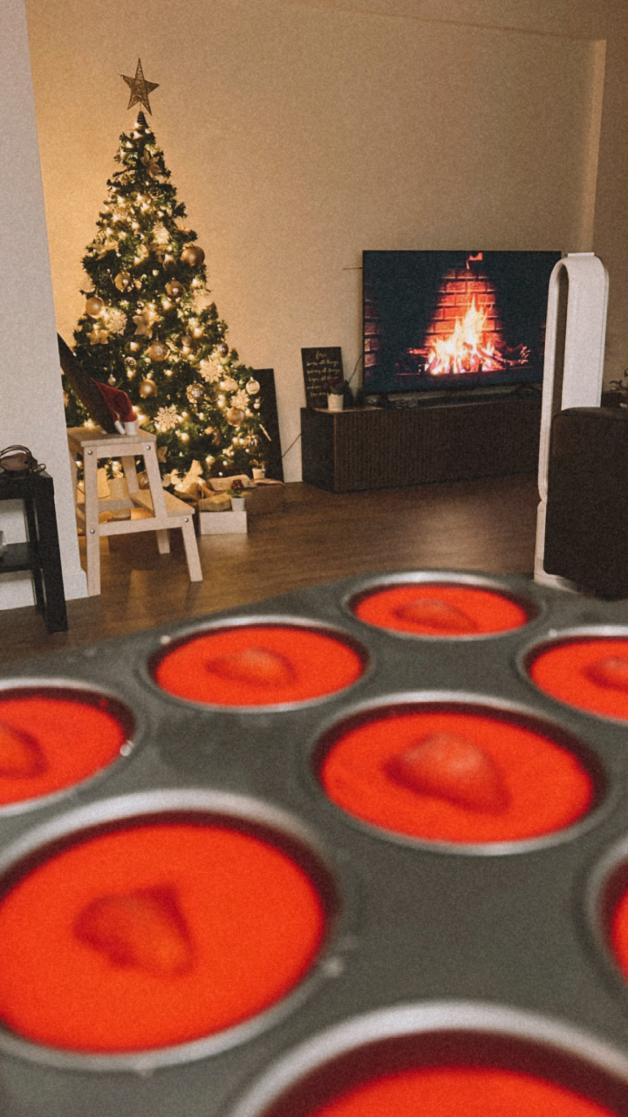 Creating our japandi home on a budget 🤎 - Christmas tree with star on top, fireplace with burning fire, wooden stool with