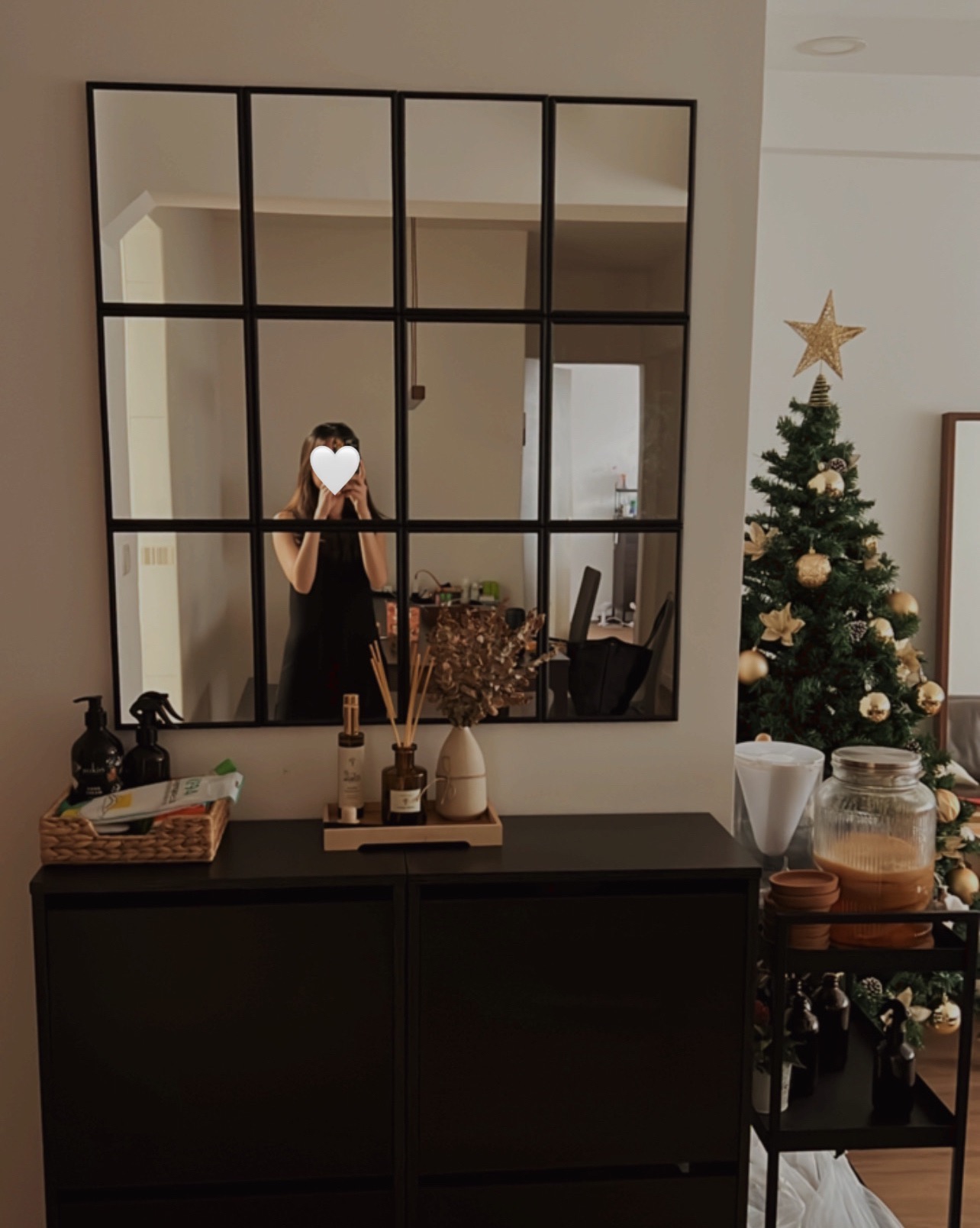 Creating our japandi home on a budget 🤎 - Large mirror, black dresser, decorative items, Christmas tree, gold ornaments