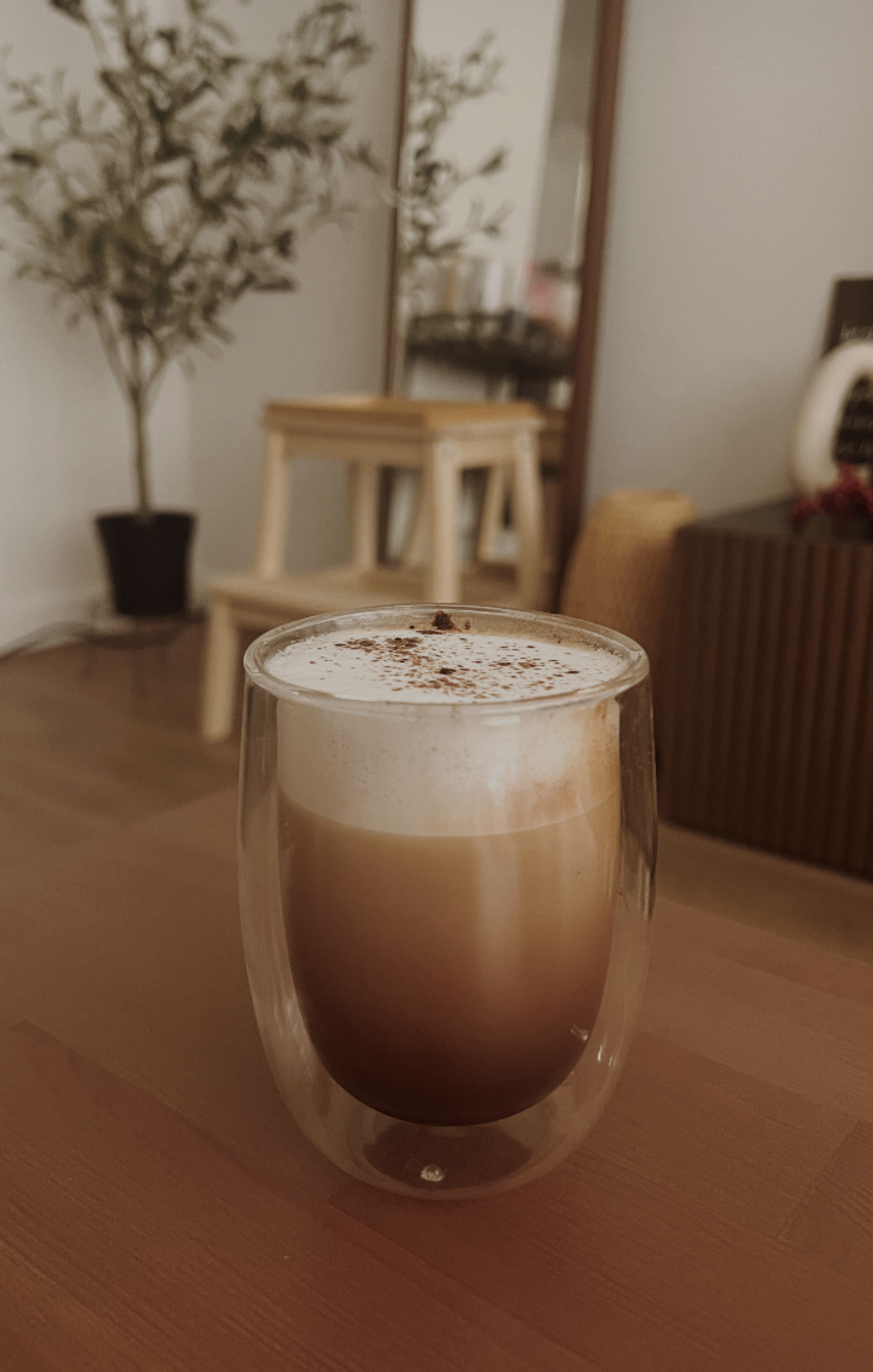 Creating our japandi home on a budget 🤎 - glass of latte, frothy milk, caramel sprinkles, cozy cafe, wooden table, indoor