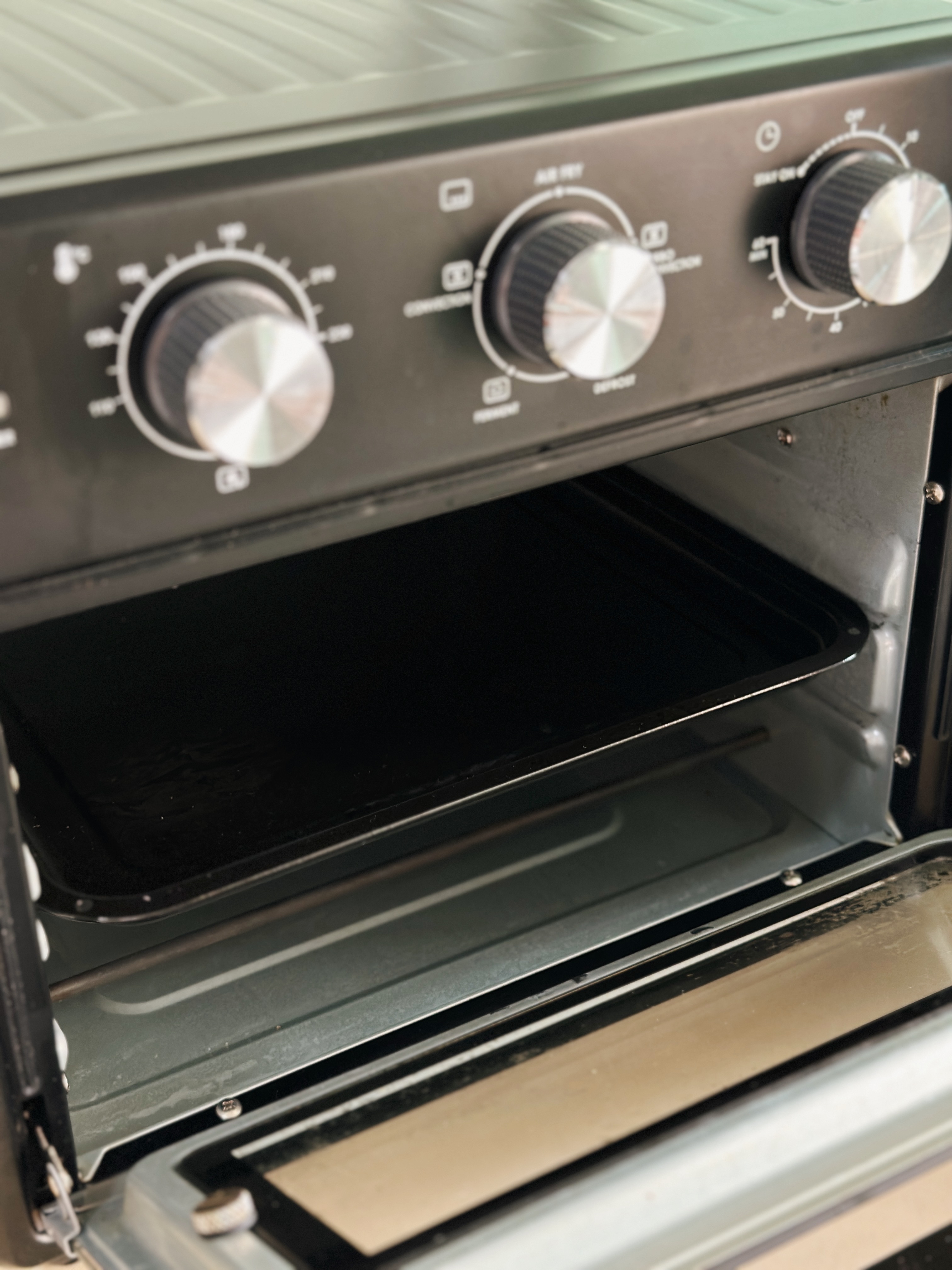 Our Most Used Home Appliance: Air Fryer Oven For Less than $200! - oven control panel, black interior, control knobs, digital