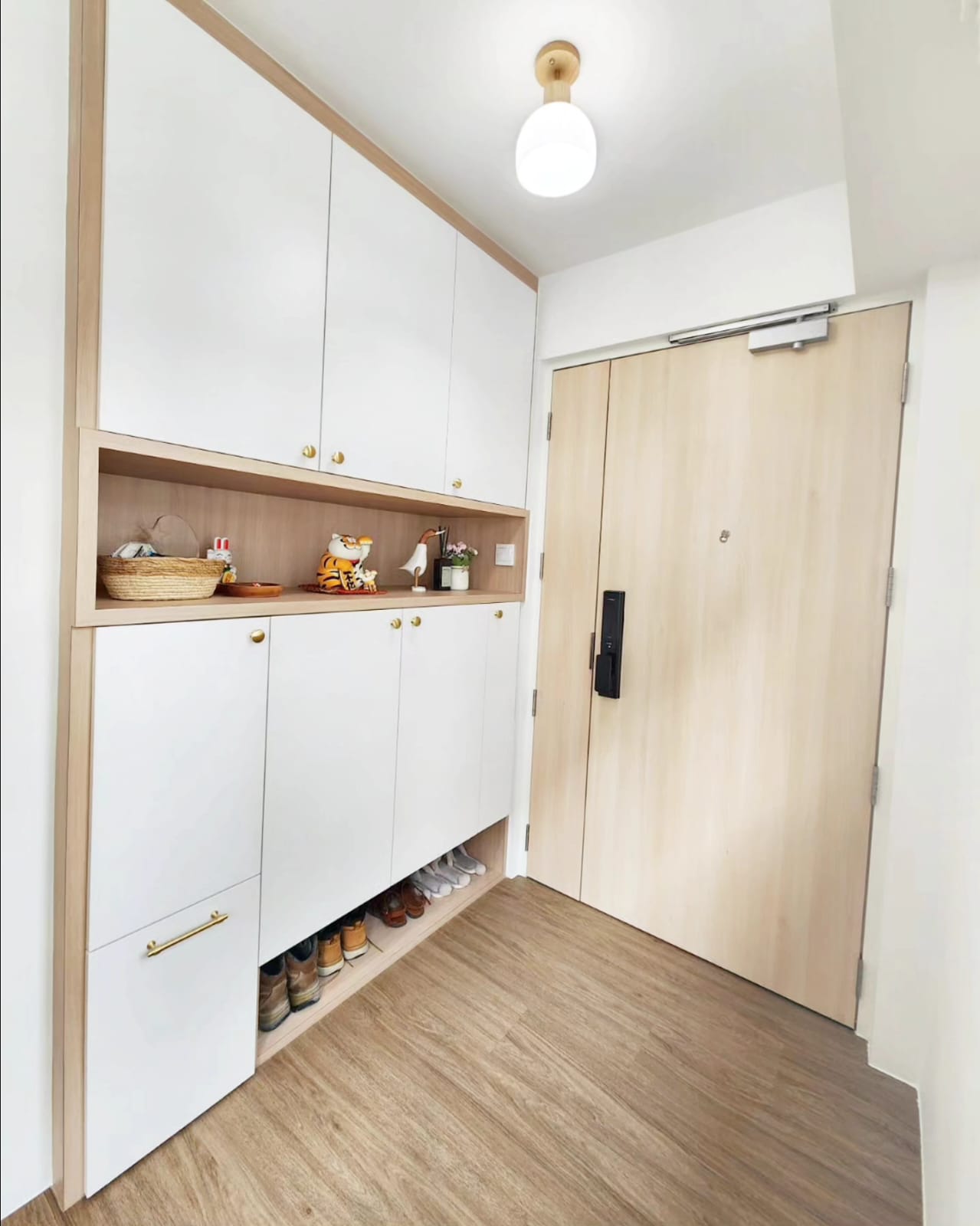 Living in our dream Wang Gong  - Wooden cabinet, white interior, gold handles, open shelf, decorative items, basket, small