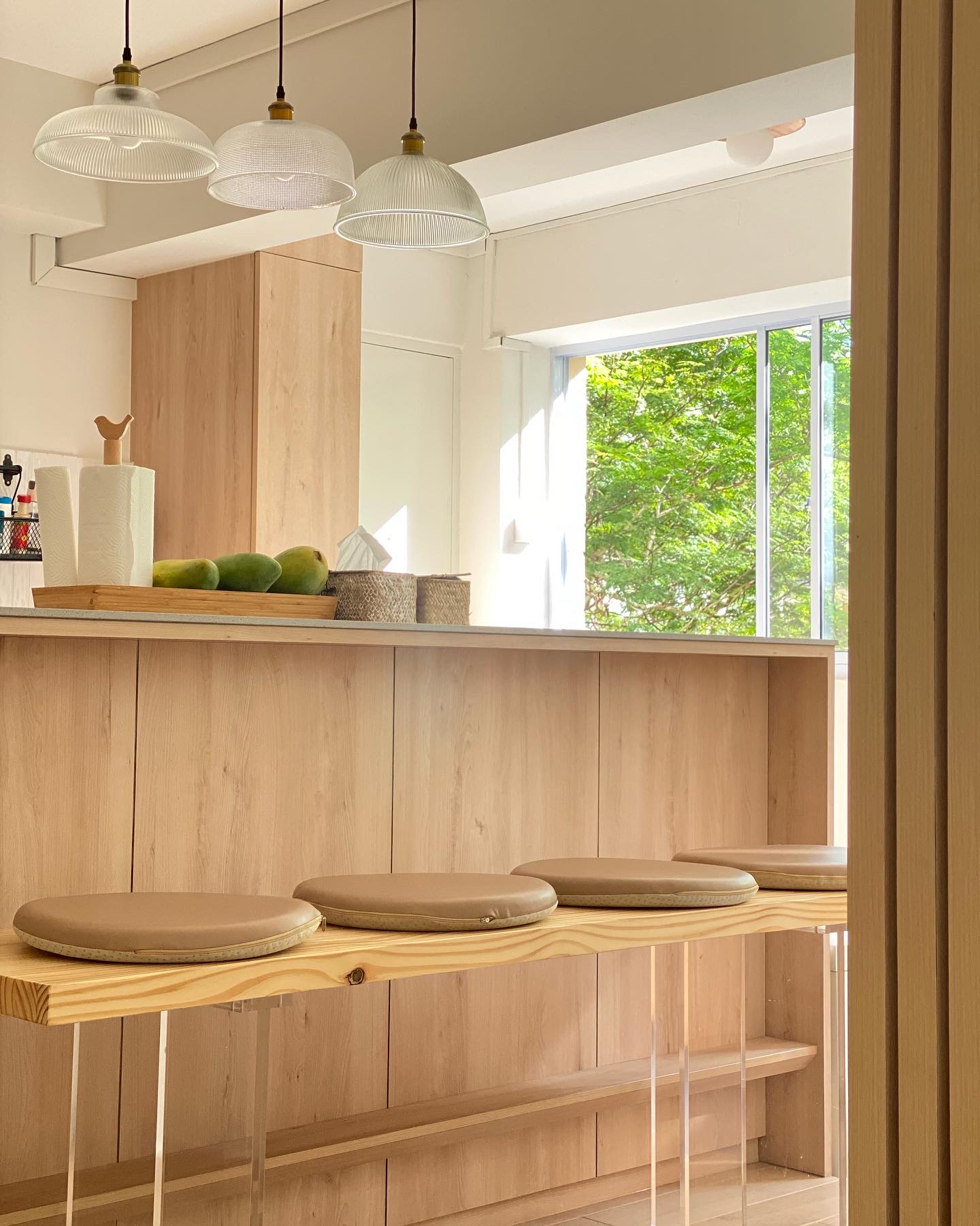 House designed to outsmart hungry dogs - Wooden kitchen island, minimalist design, natural light, modern decor, light wood