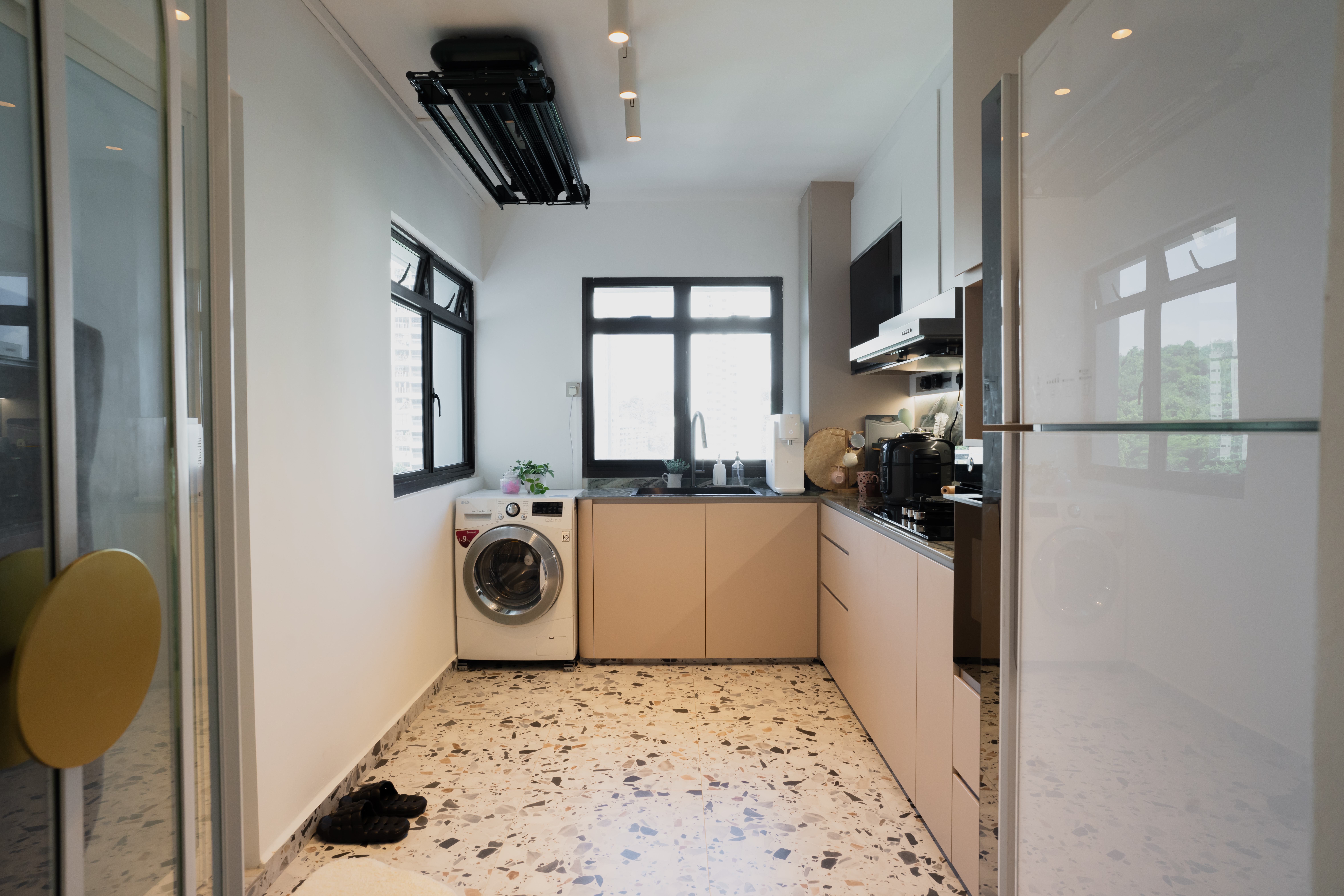 Italian cafe inspired theme  - Modern kitchen with white cabinetry, stainless steel appliances, and a marble floor. Washer