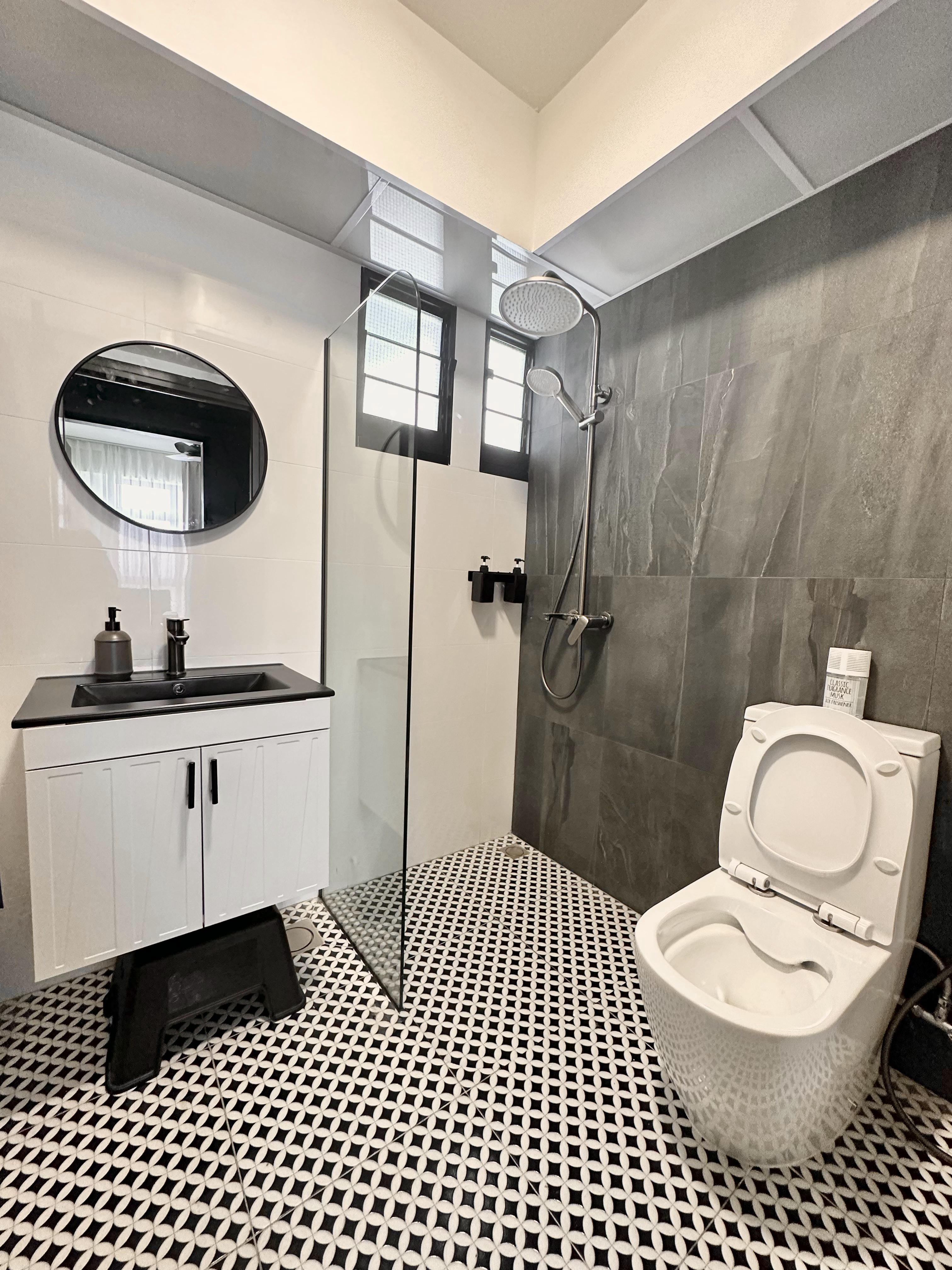 Welcome to oureastsideflat! ✨ - Modern bathroom with sleek design, black and white color scheme, large mirror, glass shower