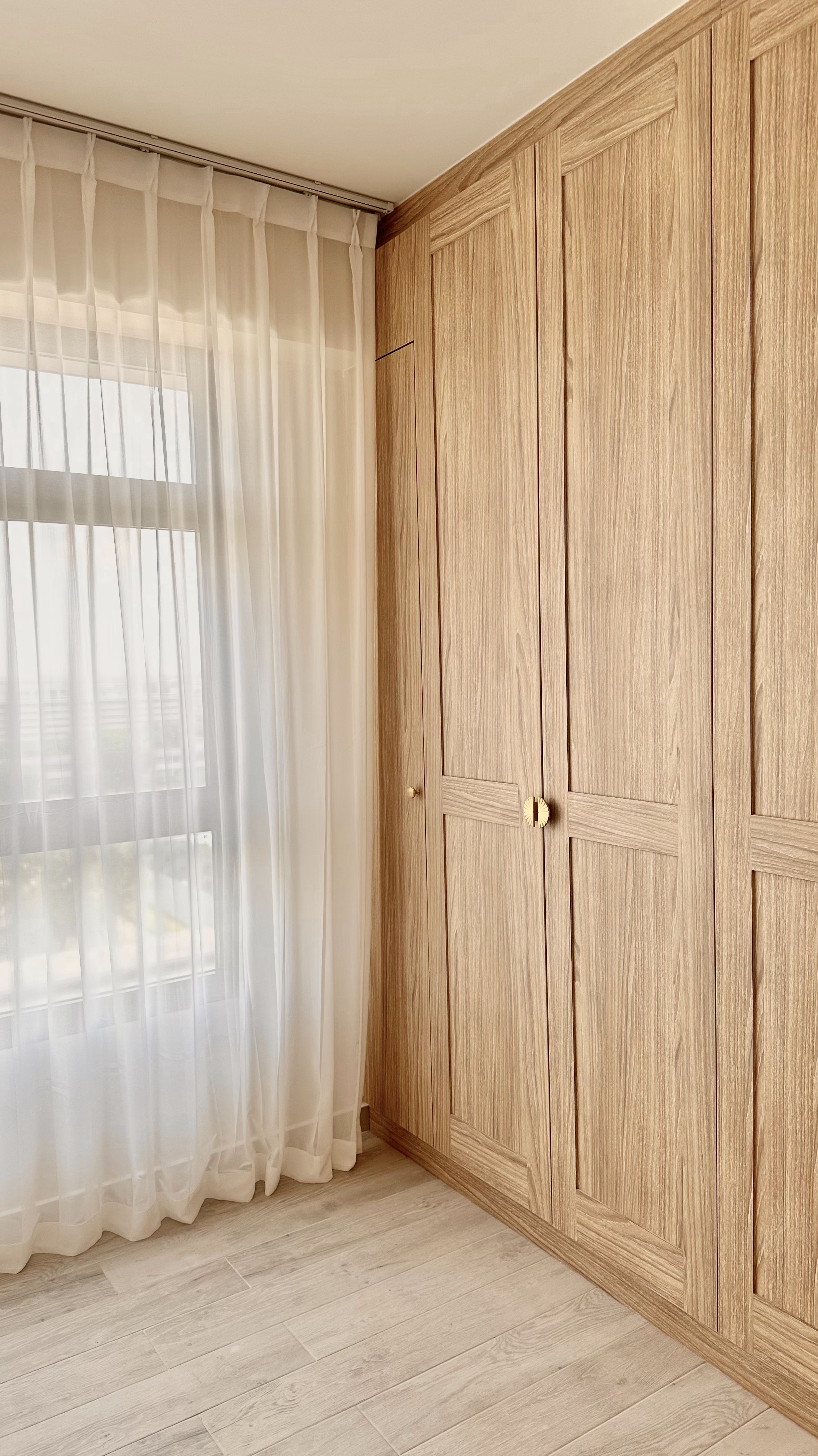 Welcome to oureastsideflat! ✨ - Light wood cabinetry, sheer white curtains, natural light streaming through, wooden door
