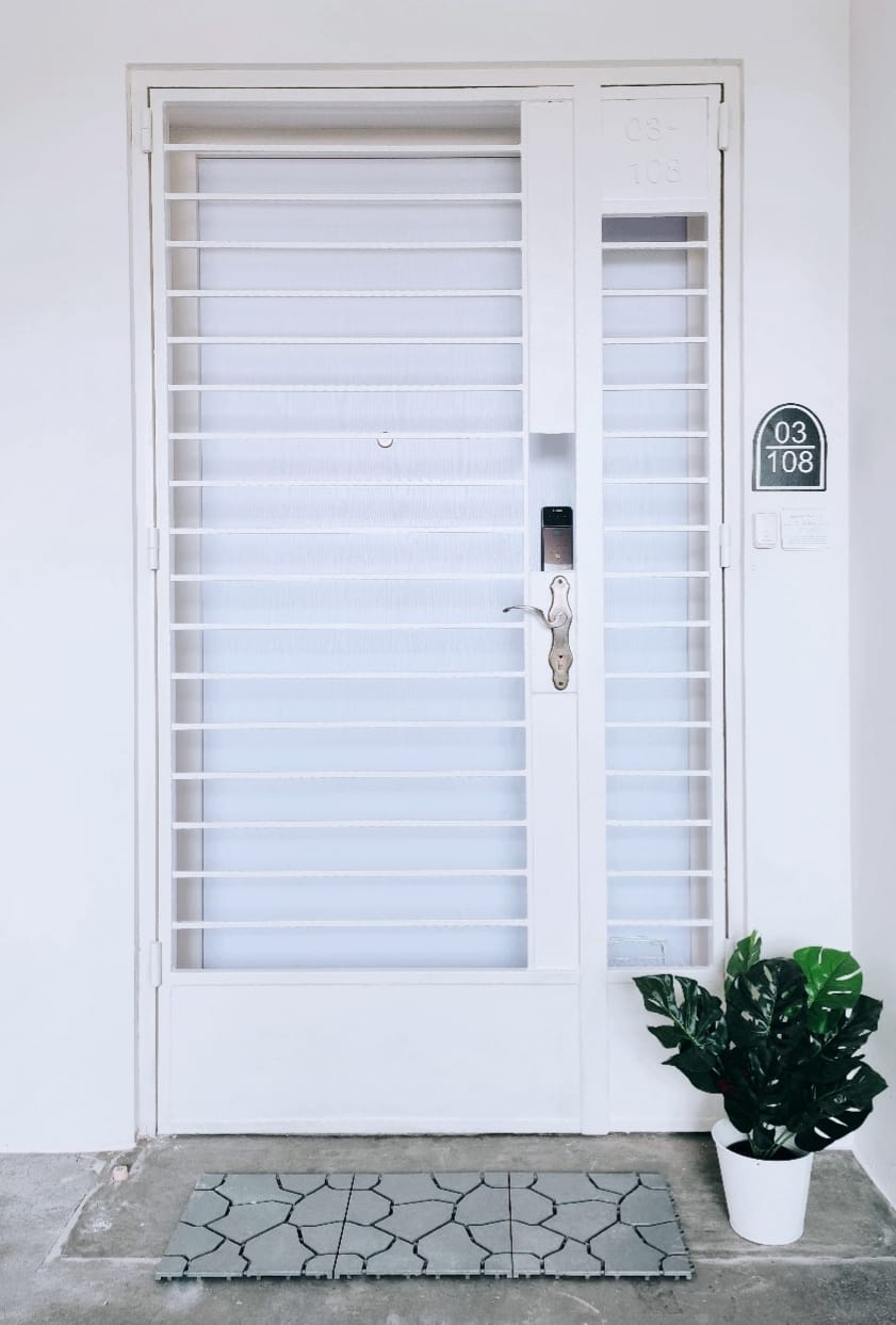 PunggoHField's white minimalist home at $25k - White door with horizontal blinds, number 03 108, potted plant, concrete