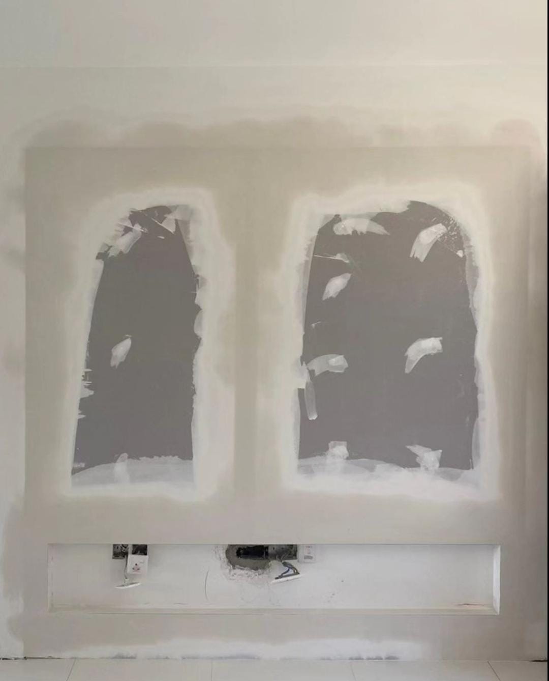 PunggoHField's white minimalist home at $25k - Two rectangular windows with white plaster edges on a white wall., Dark