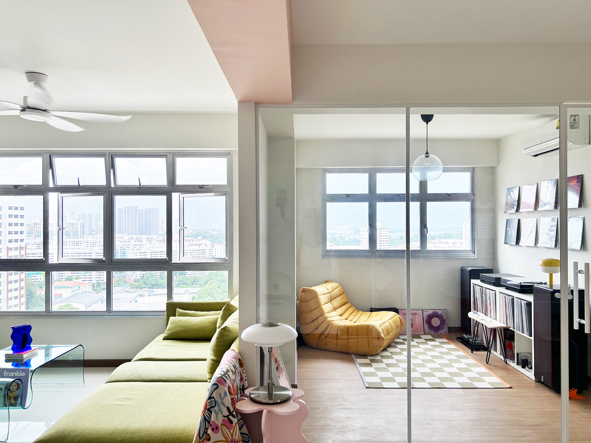 A quirky 93sqm home with pops of colour and 3 cattos - Modern living room with large windows, green sofa, yellow lounge