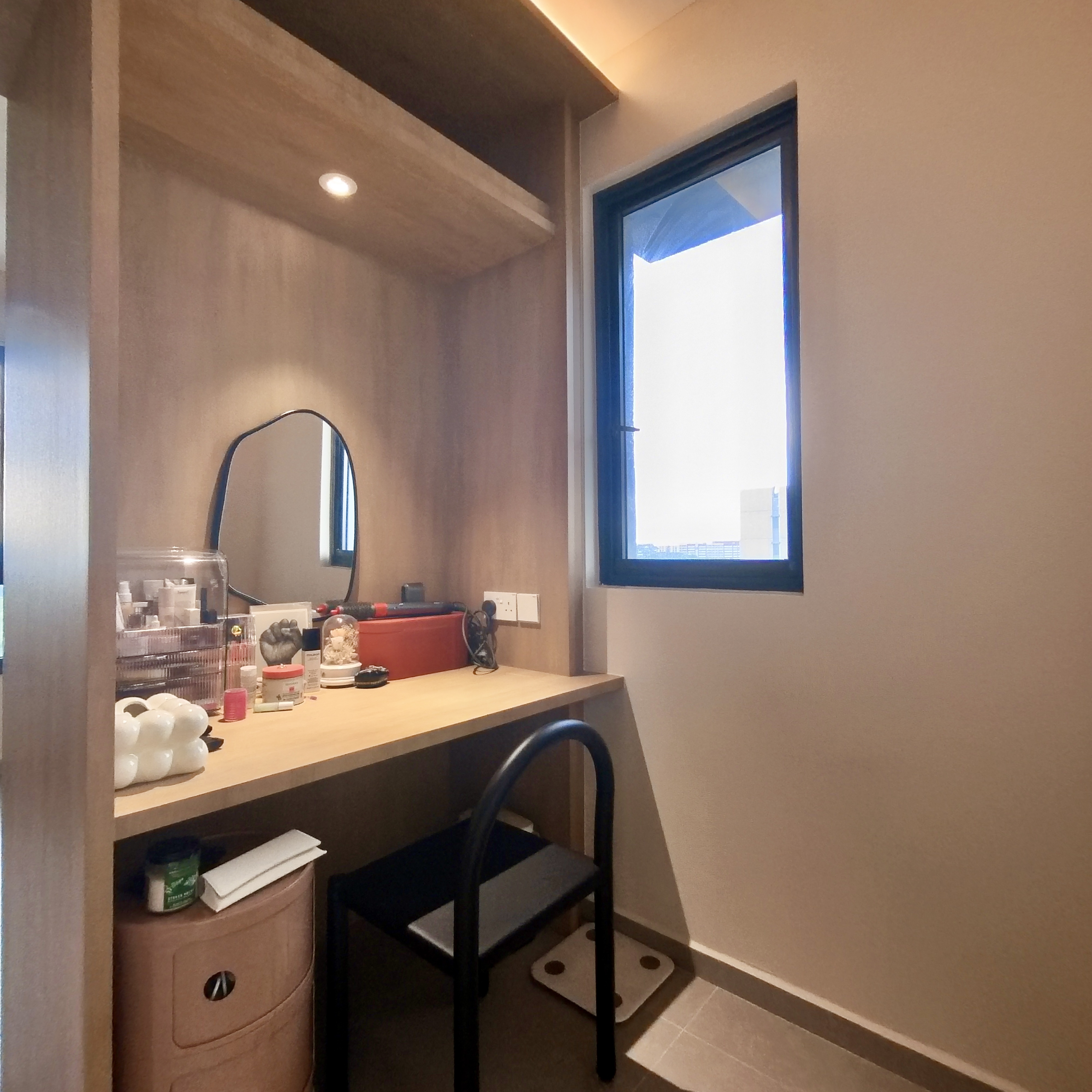 Come take a walk through our minimalist home - Wooden vanity, mirror, desk, black chair, small stool, light beige walls