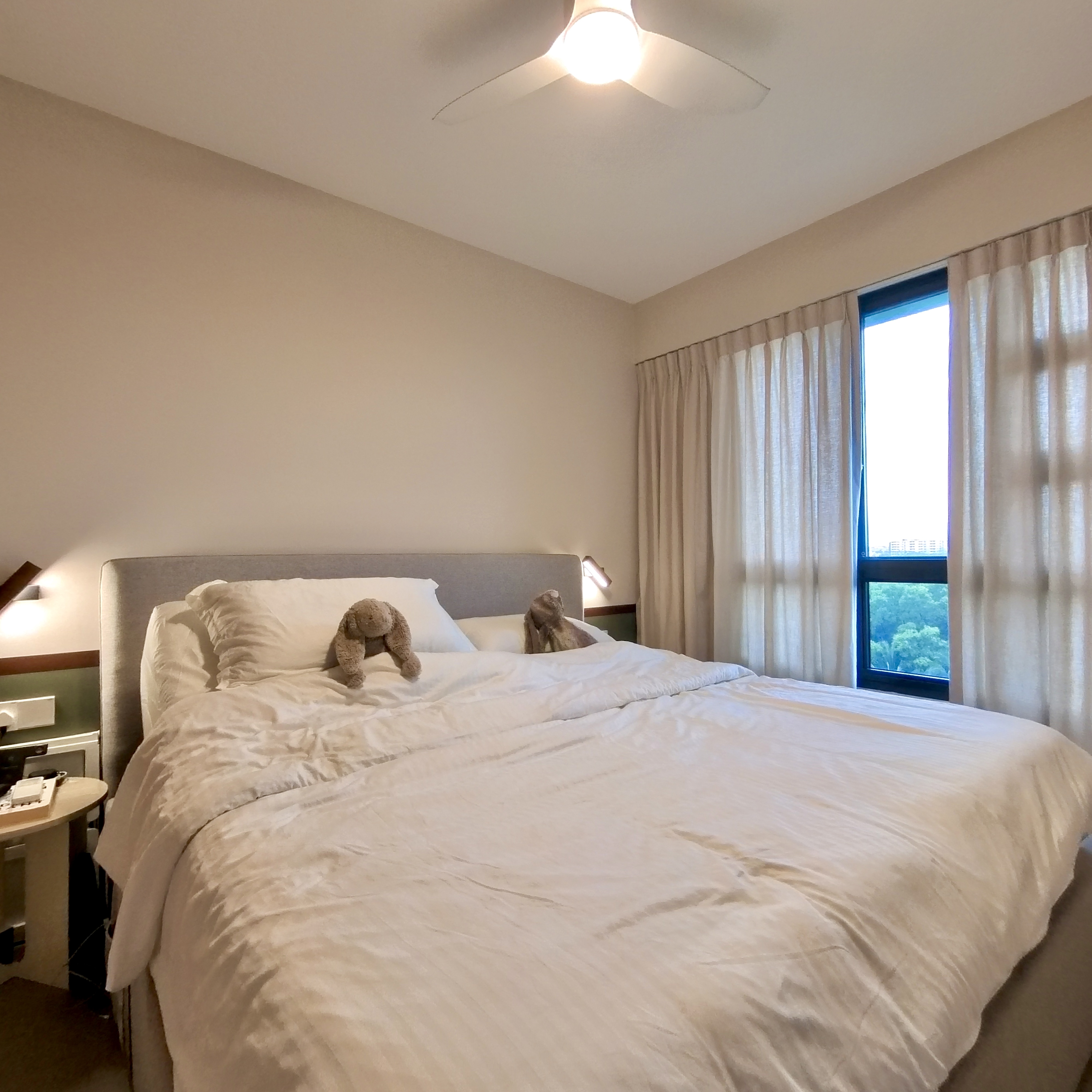 Come take a walk through our minimalist home - Comfortable bed with plush pillows and a cozy blanket, neatly made bed with a