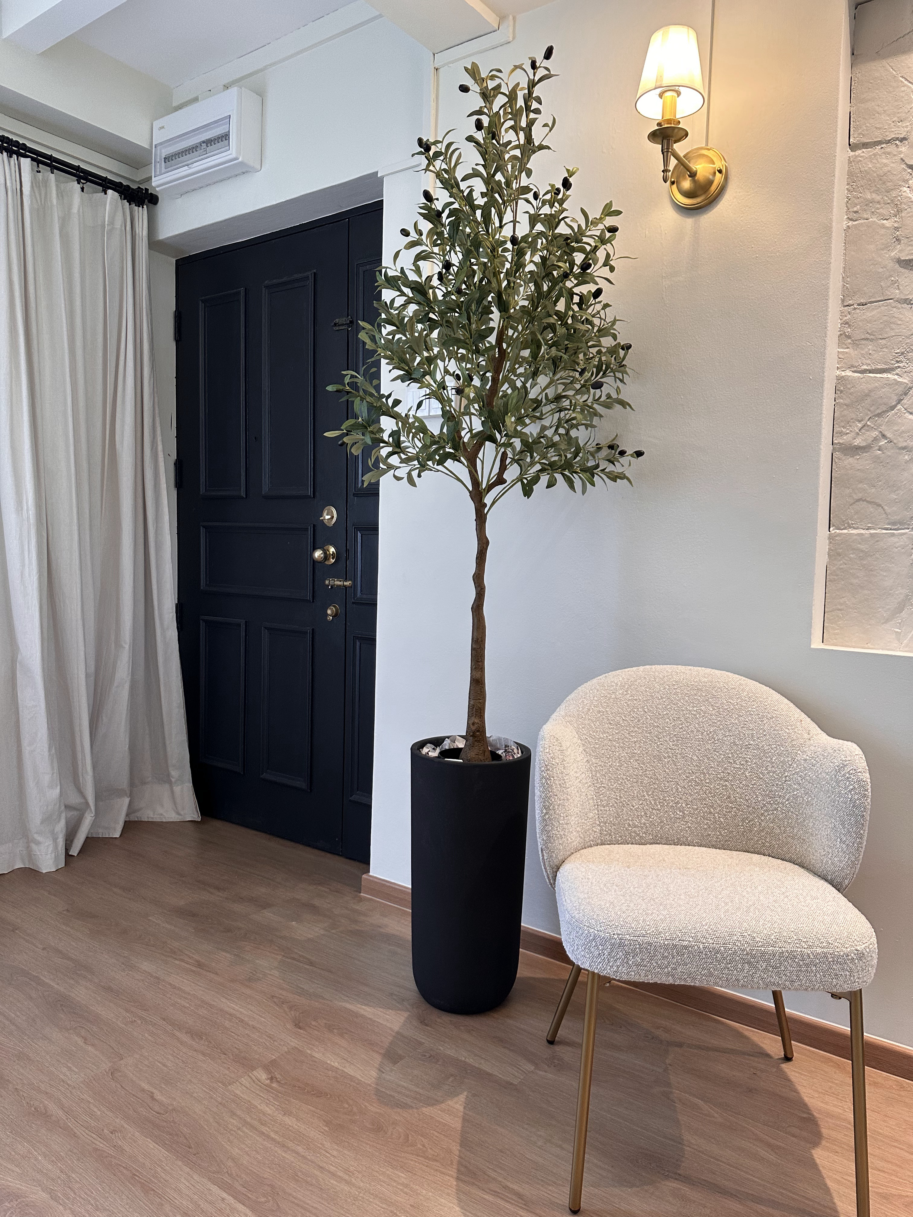 Upgrade outdated wall  - White air conditioning unit, beige curtains, black door, white wall, textured armchair, wooden