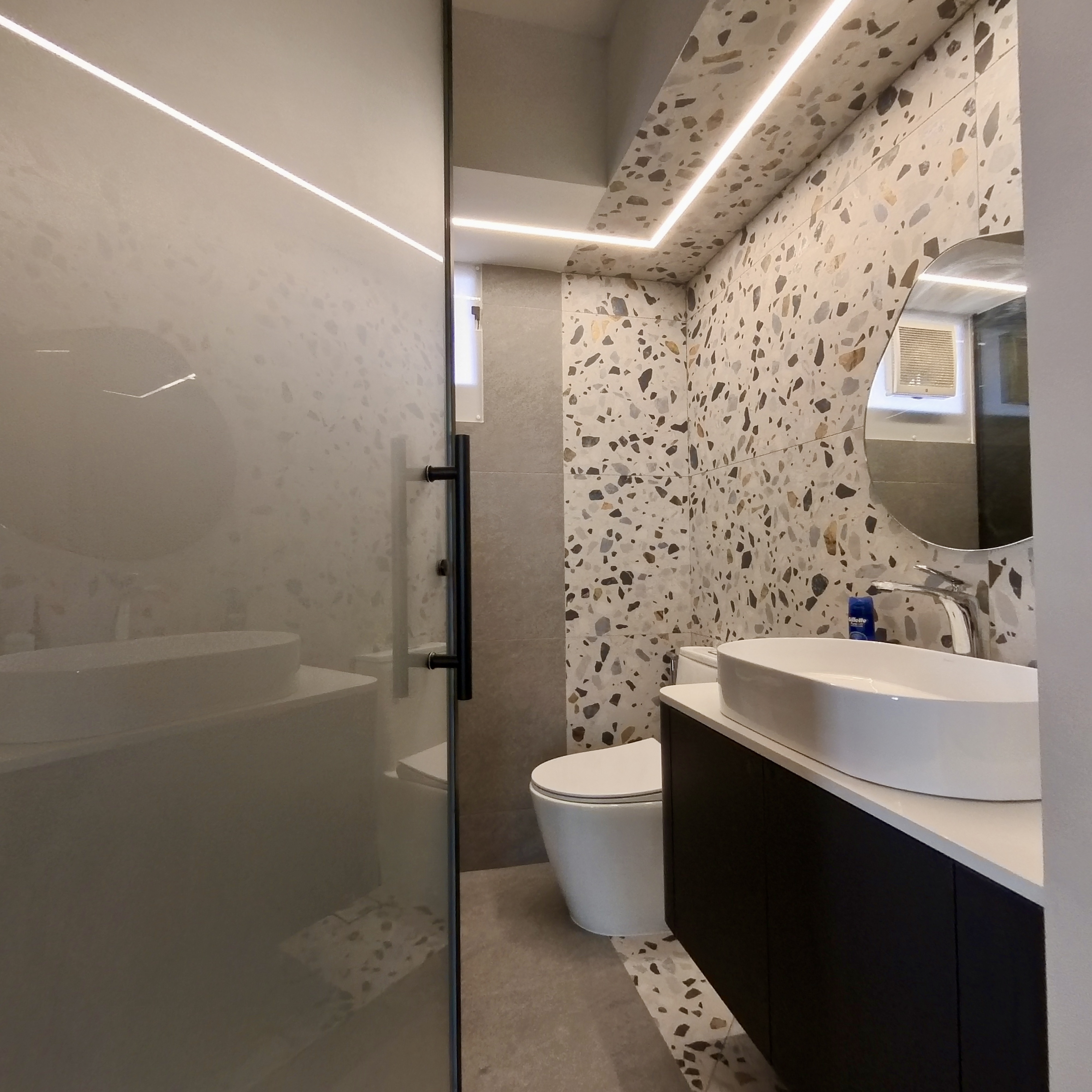 Come take a walk through our minimalist home - Modern bathroom with sleek design, contemporary fixtures, large mirror