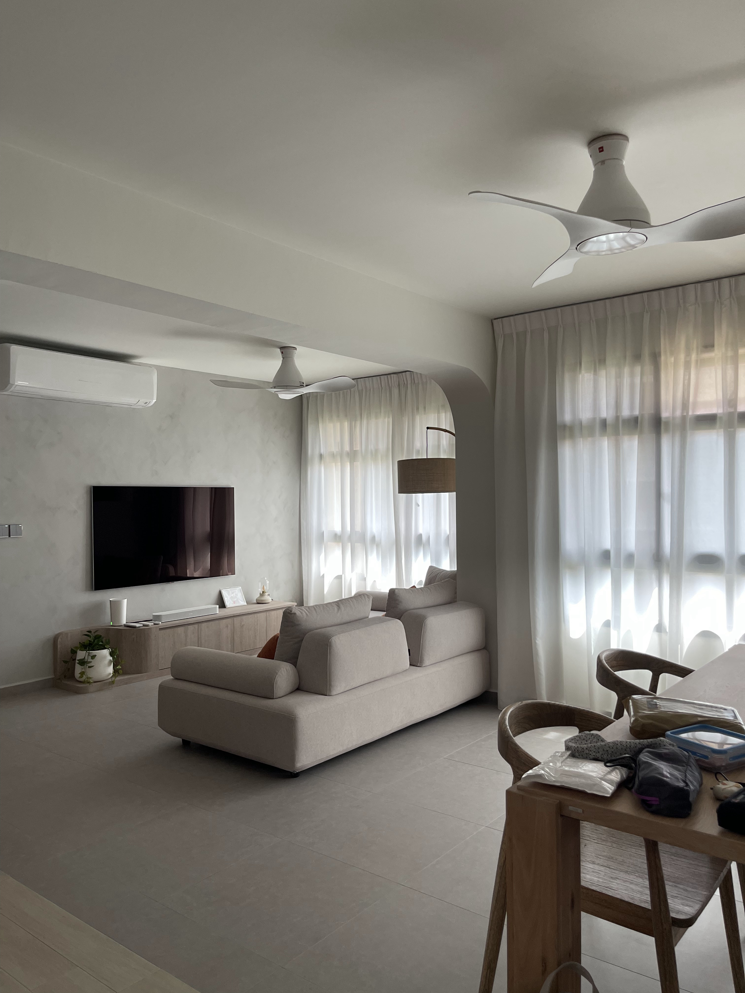 Trunks and Trees Inspired Home - Modern minimalist living room, neutral color palette, large flat-screen TV, comfortable