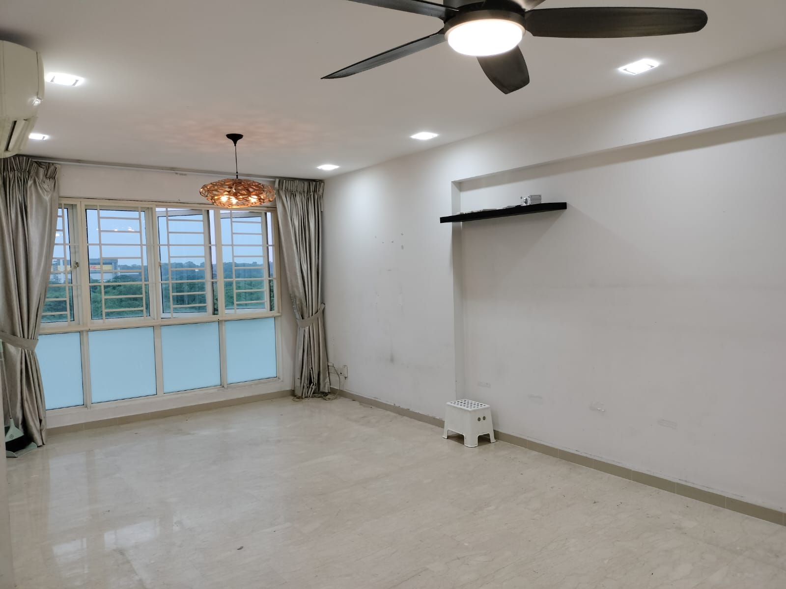 Living room where we gather for family bonding - Modern minimalist living room, spacious room with large windows, white walls