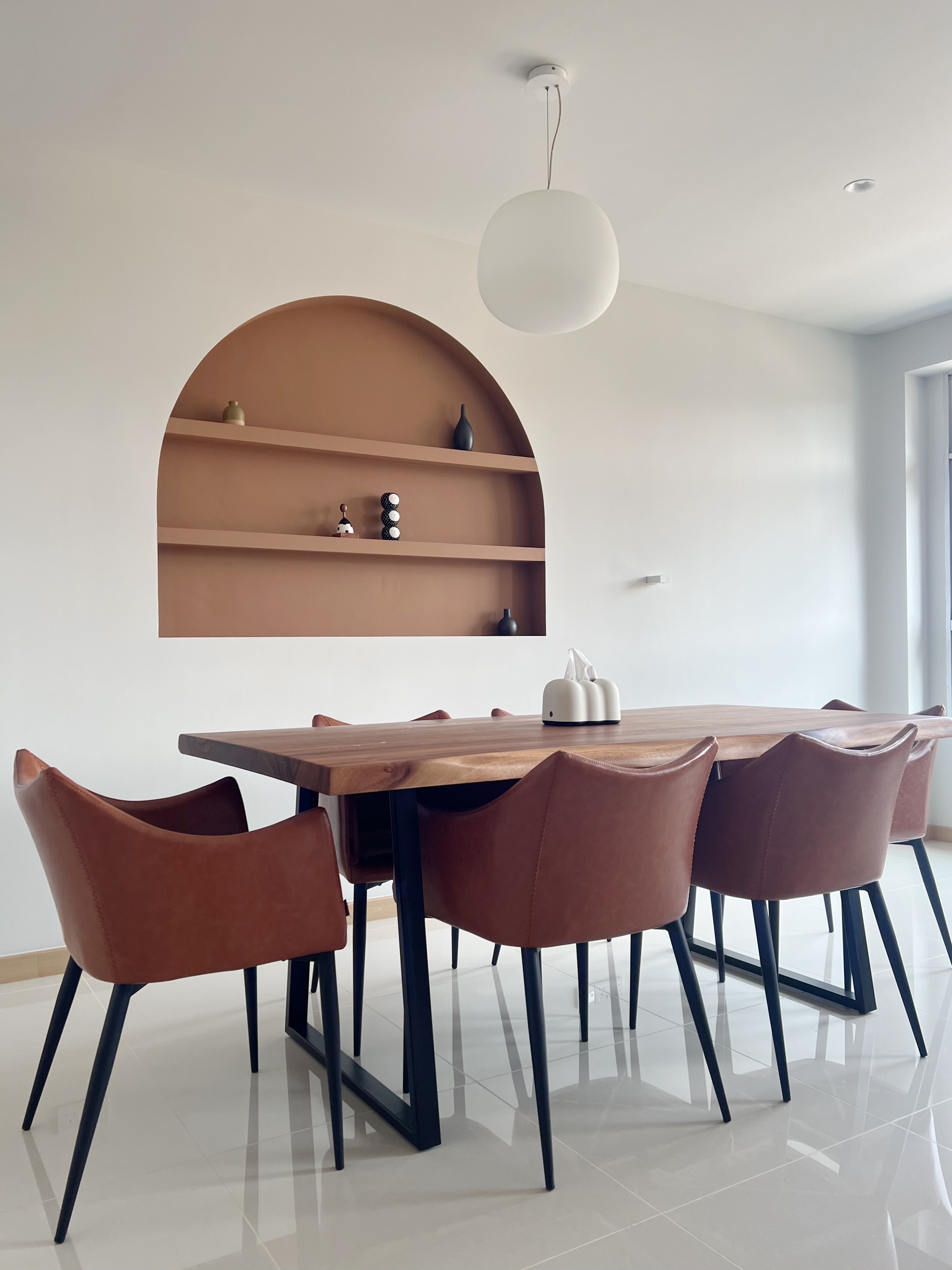 Step Inside: Our Cosy Living Room - Modern dining room with sleek brown leather chairs and wooden table, minimalist design