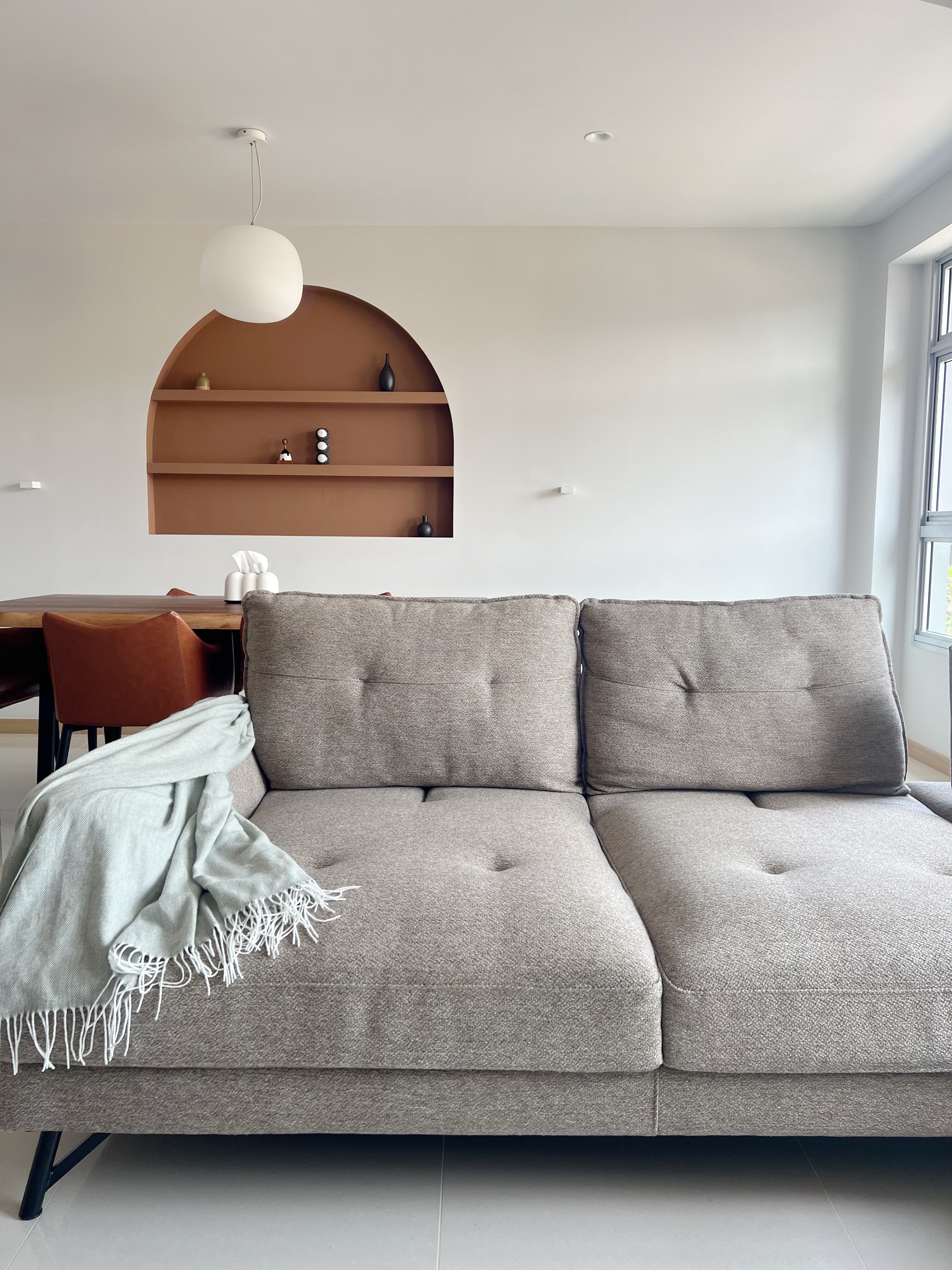 Step Inside: Our Cosy Living Room - Modern minimalist living room, neutral color palette, cozy seating area, gray tufted