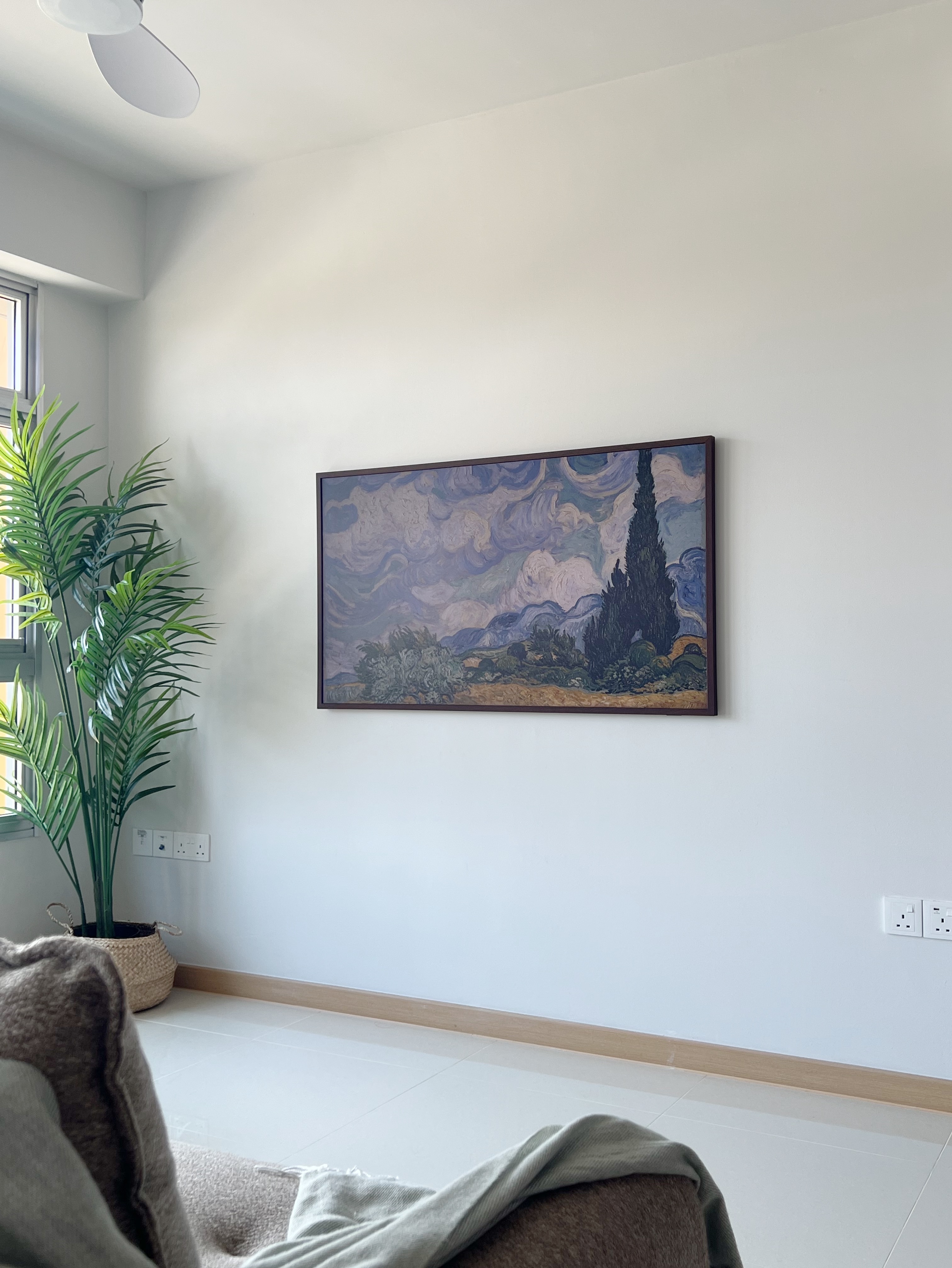 Step Inside: Our Cosy Living Room - Minimalist living space, modern art painting, large potted plant, natural light, white