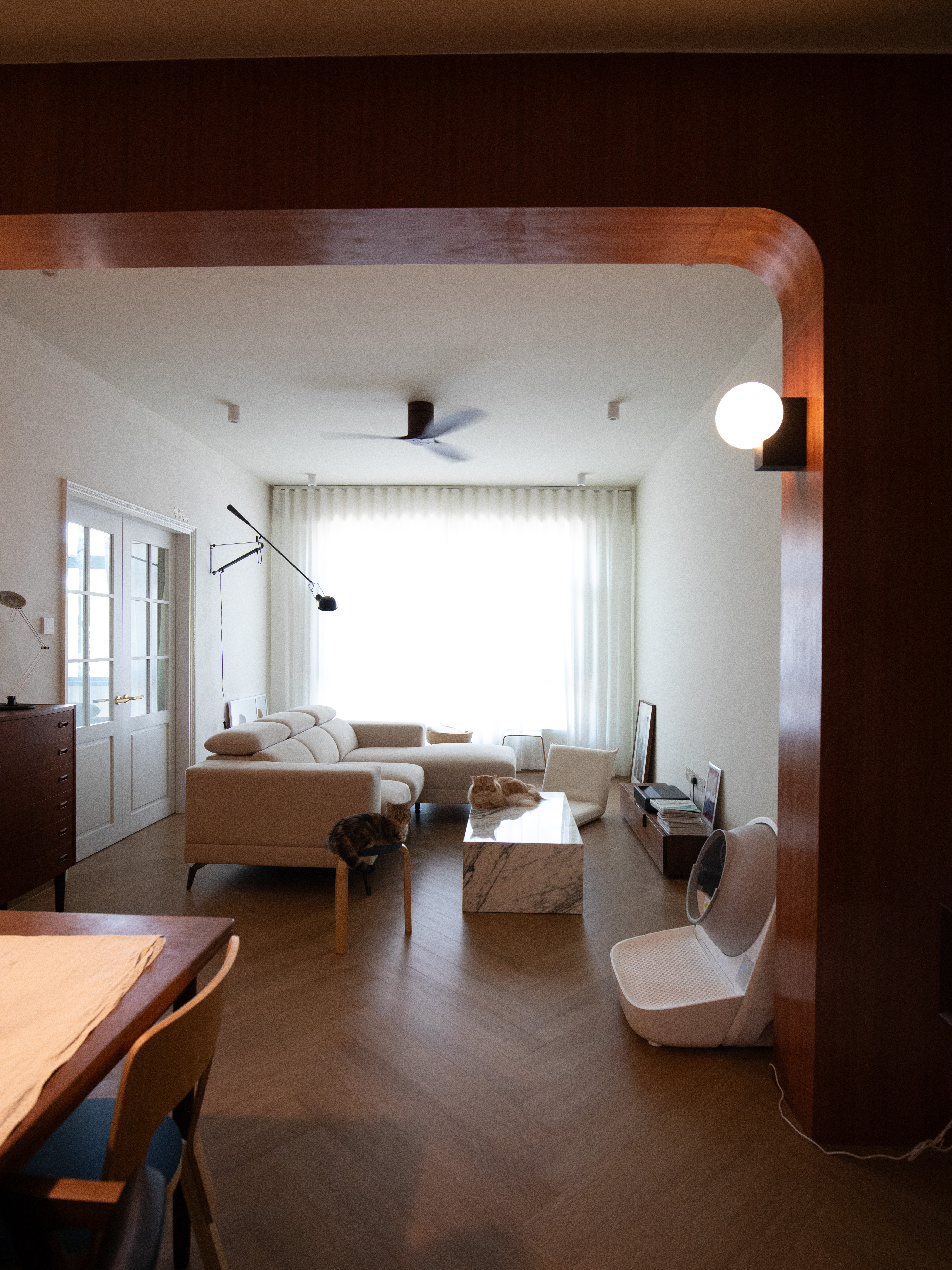 Our 4m x 5m Living Room - Modern minimalist living room, cozy seating area, large window with sheer curtains, beige sofa