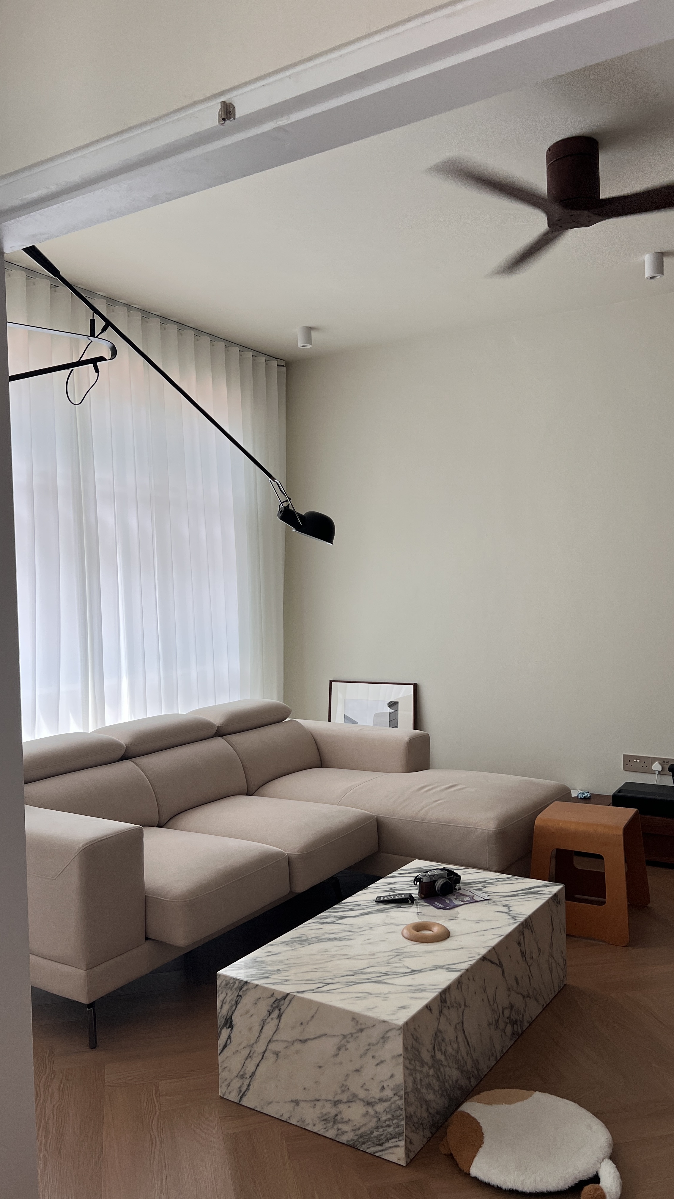 Our 4m x 5m Living Room - Modern minimalist living room, beige sectional sofa, white sheer curtains, black floor lamp, marble