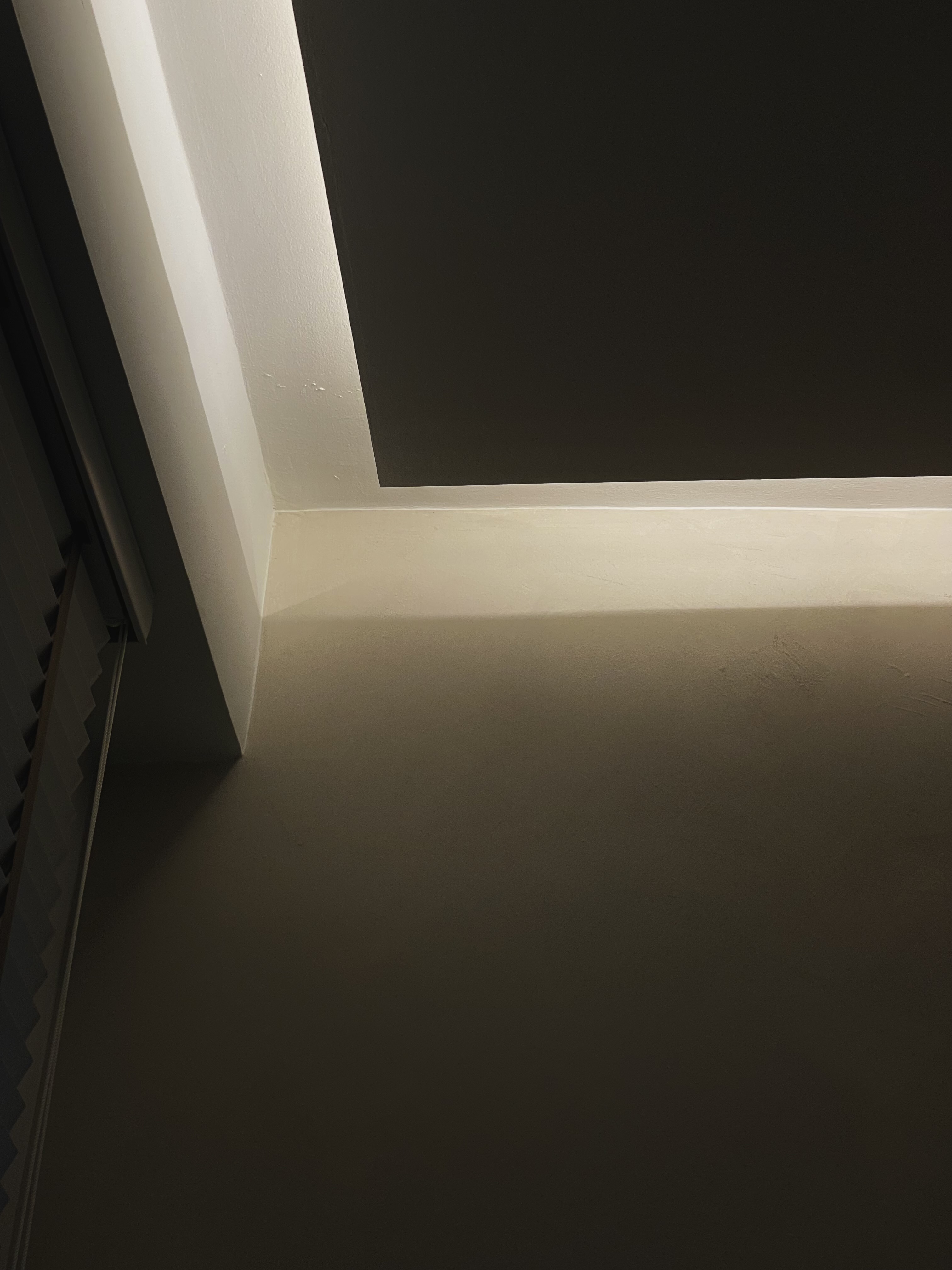 Perfecting our living room for soccer, movies & concert nights - Ceiling light casting a warm glow, minimalist design, soft