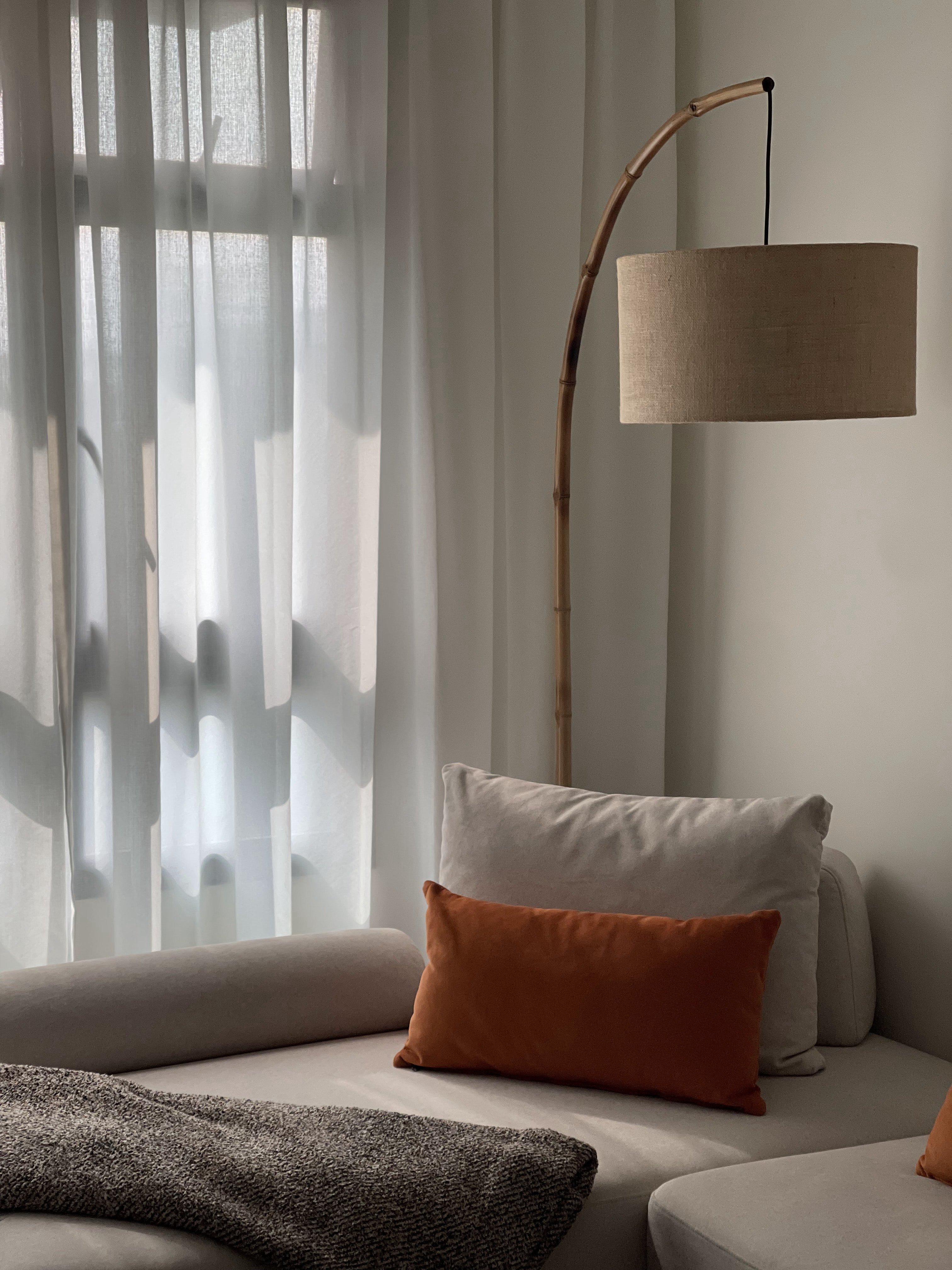 A Living Room with TLC: Textures, Lighting and Colours  - Soft, diffused light filters through sheer curtains, casting gentle