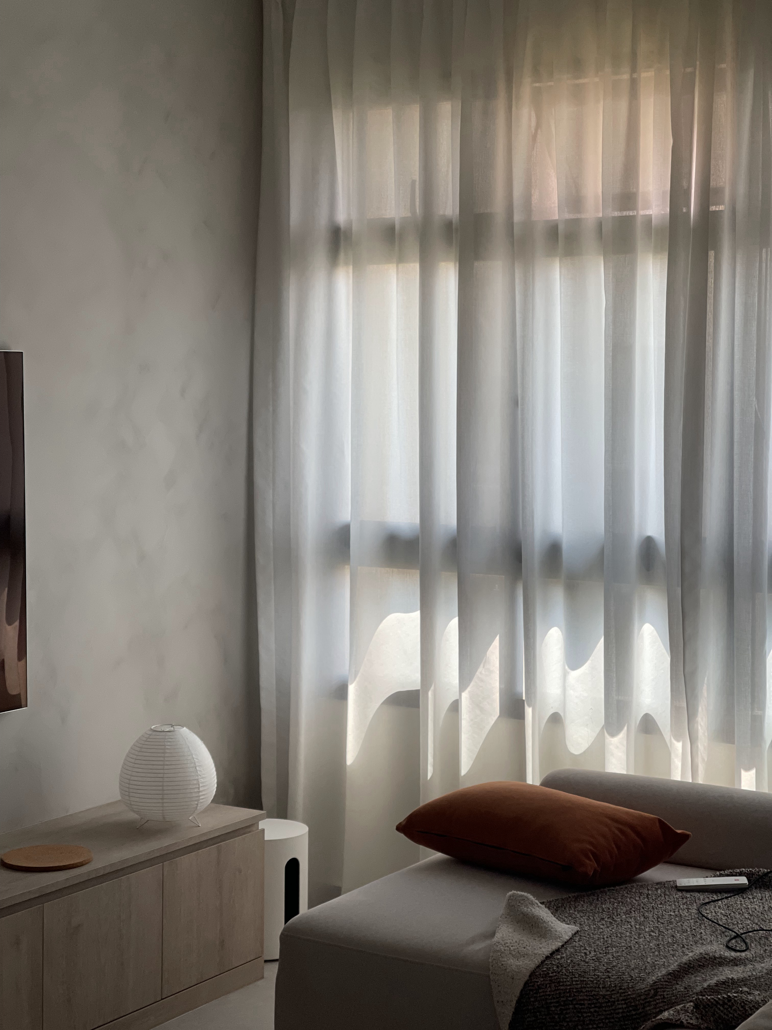 A Living Room with TLC: Textures, Lighting and Colours  - Soft, diffused light filters through sheer curtains, casting gentle