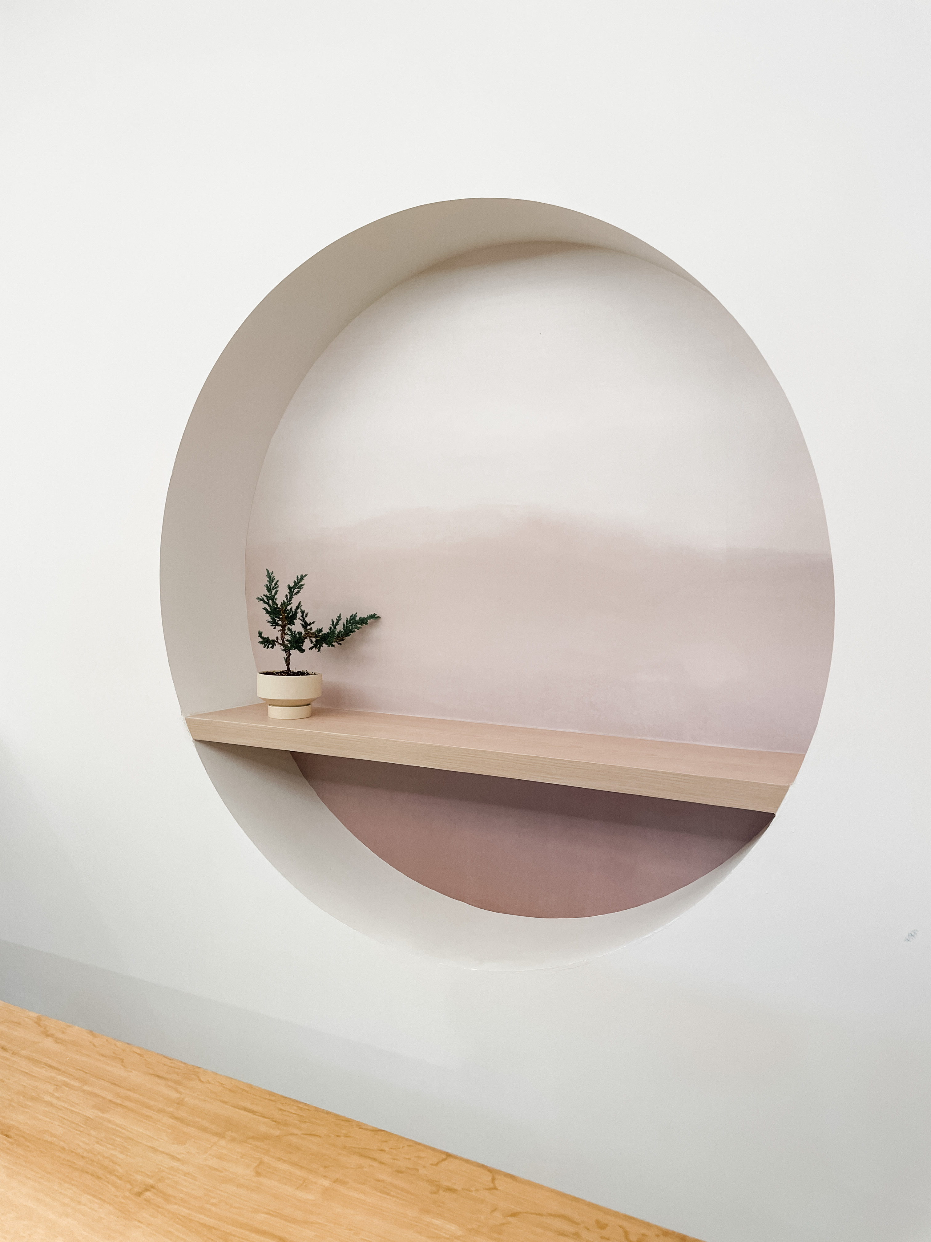 A Communal Space For Craft, Coffee & Conversations - Minimalist wall art, modern interior design, circular window, light