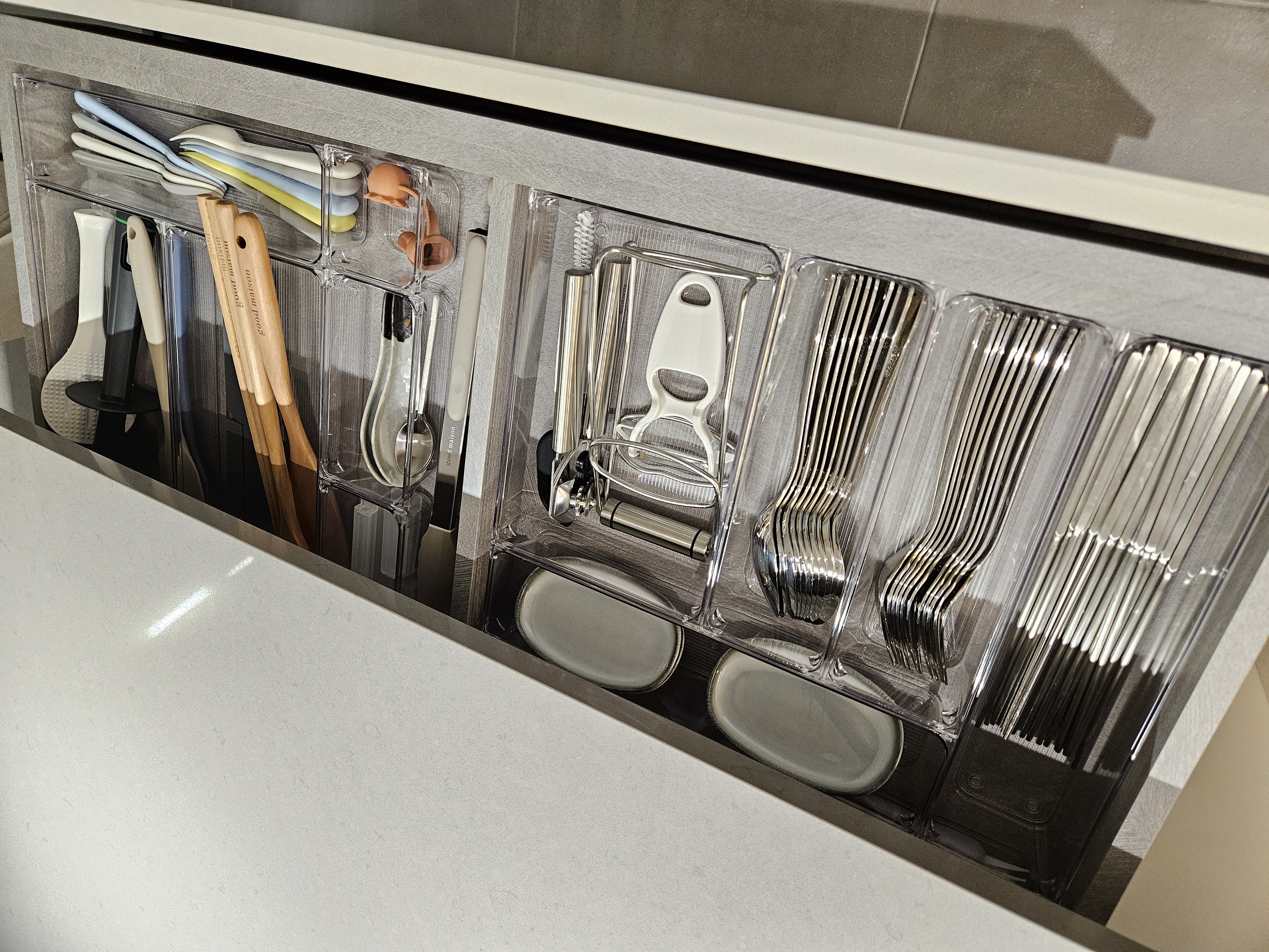 Oddly Shaped Dining Table and Island - Clear plastic drawers, neatly organized utensils, stainless steel forks