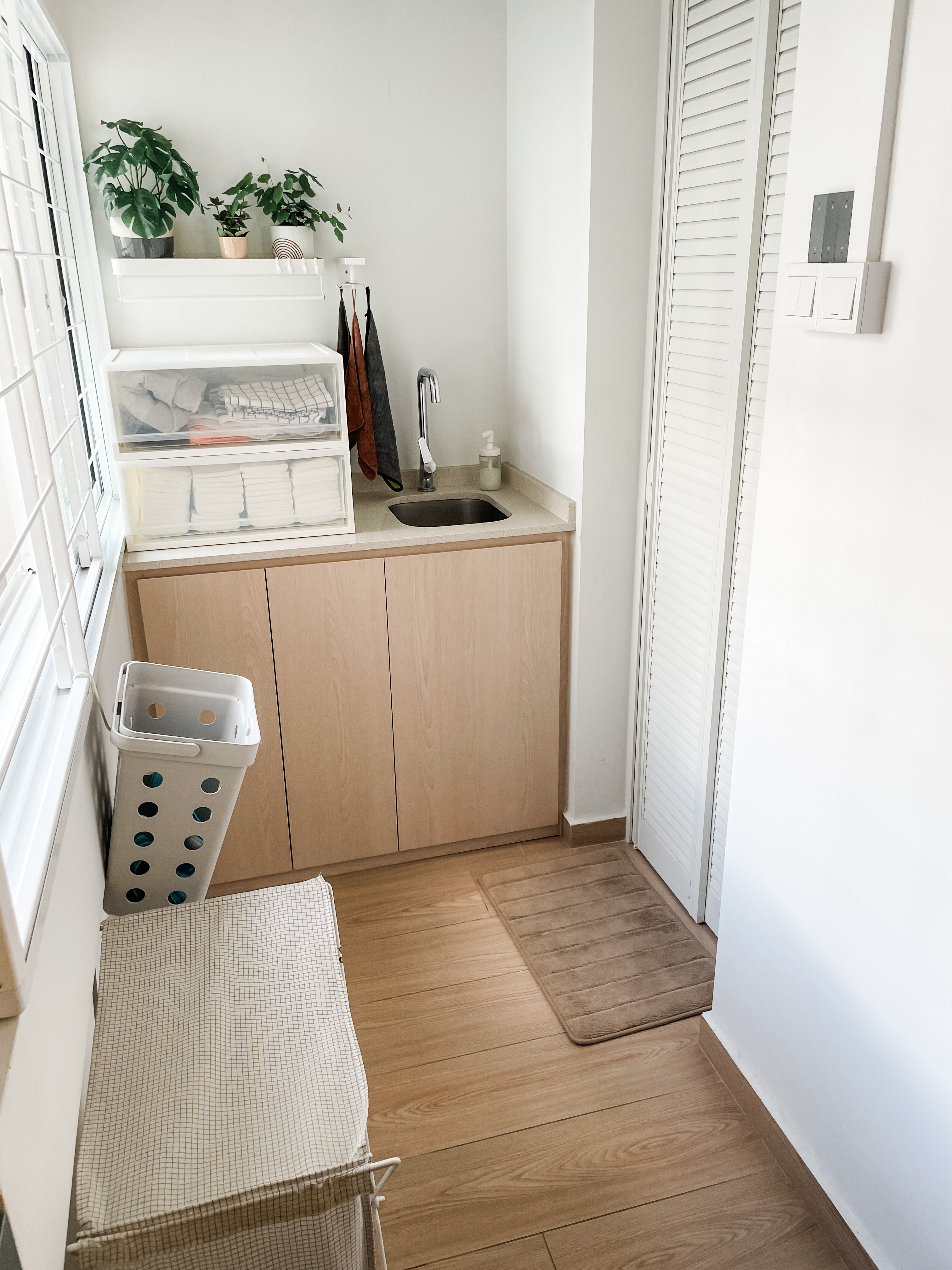 House-Hunting: Seeking a Spacious Home for our Growing Family Of Four  - White laundry basket, wooden cabinet, light brown