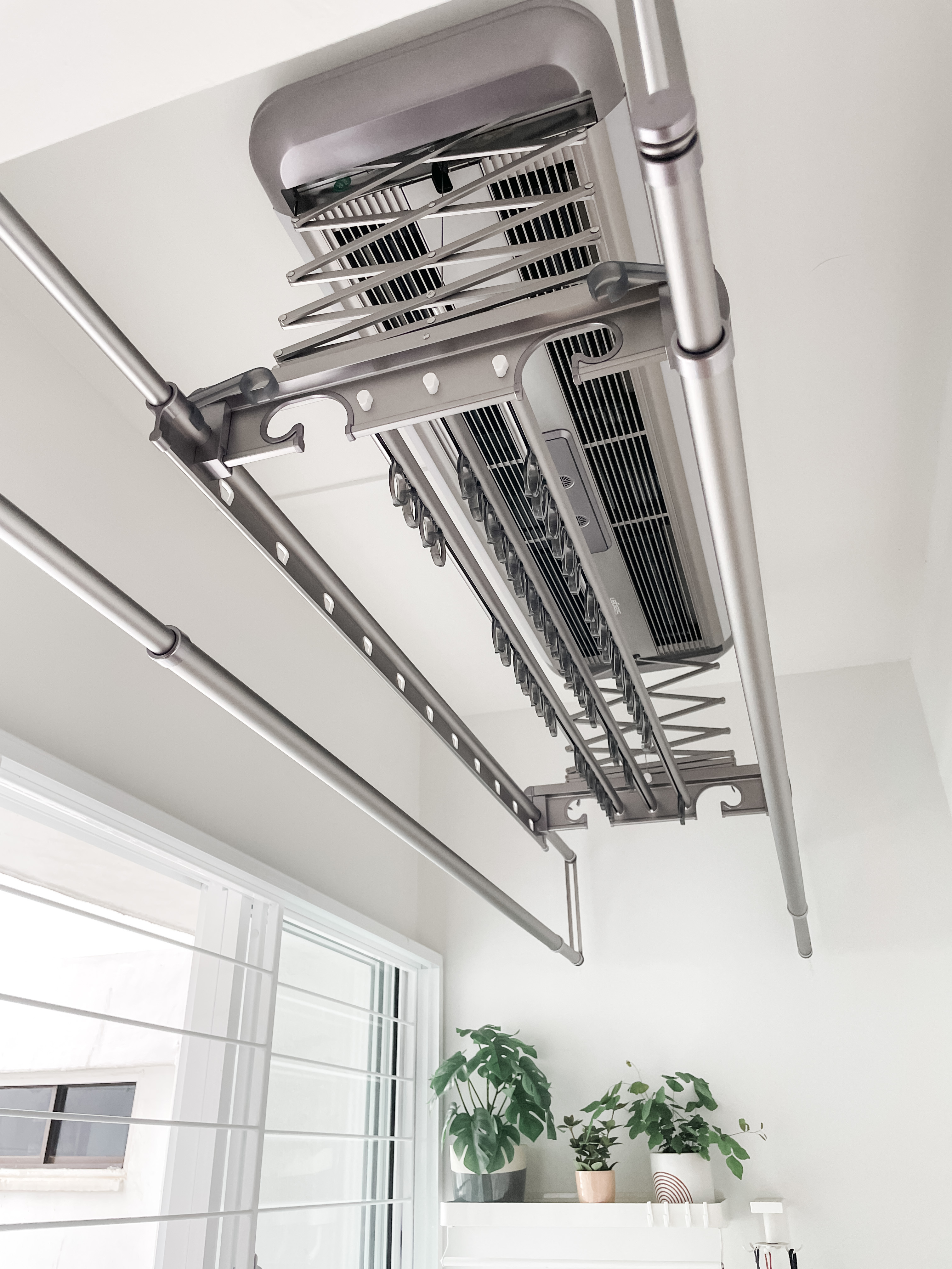 House-Hunting: Seeking a Spacious Home for our Growing Family Of Four  - Modern ceiling air conditioning unit, sleek metal