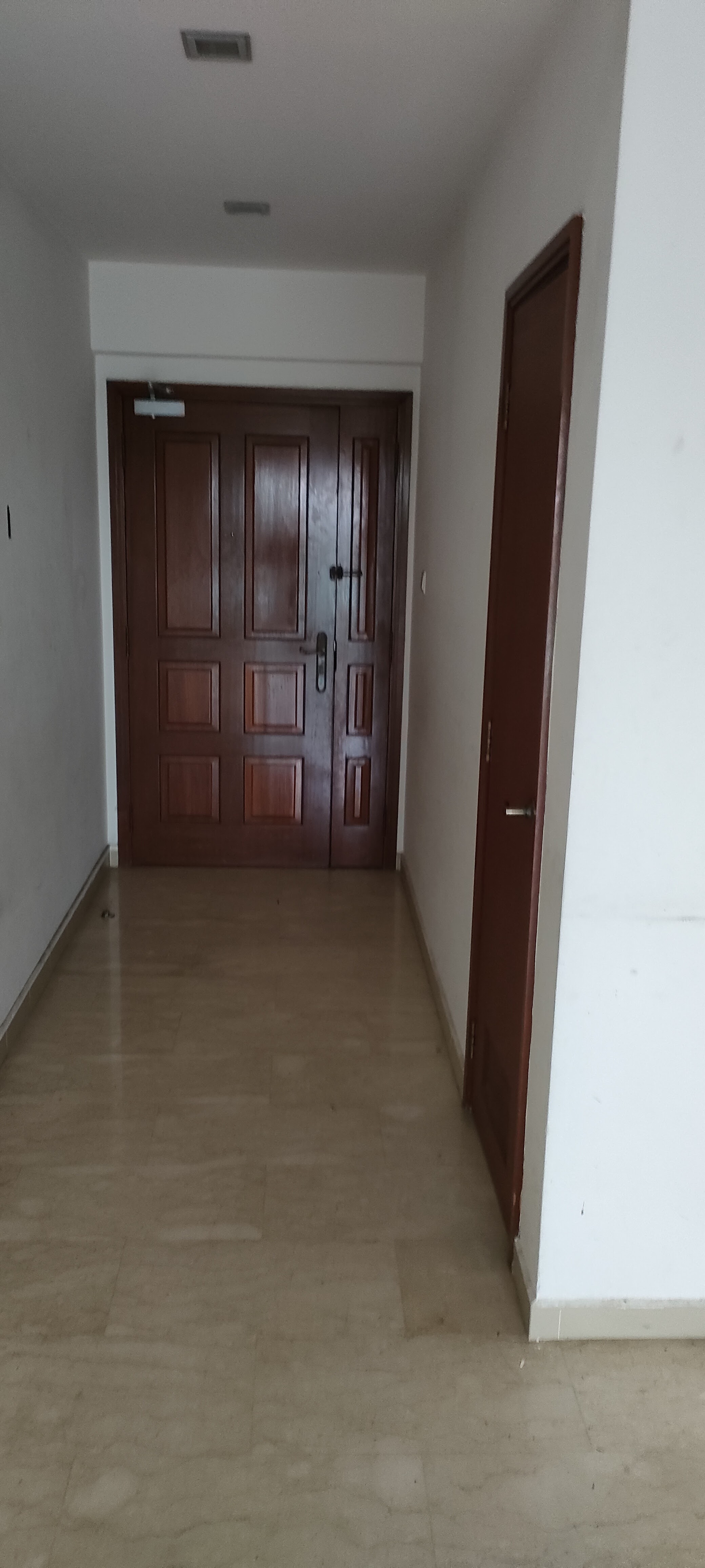 We had no dining area so we created one! - Wooden doors, hallway, white walls, light brown floor, recessed lighting, wooden